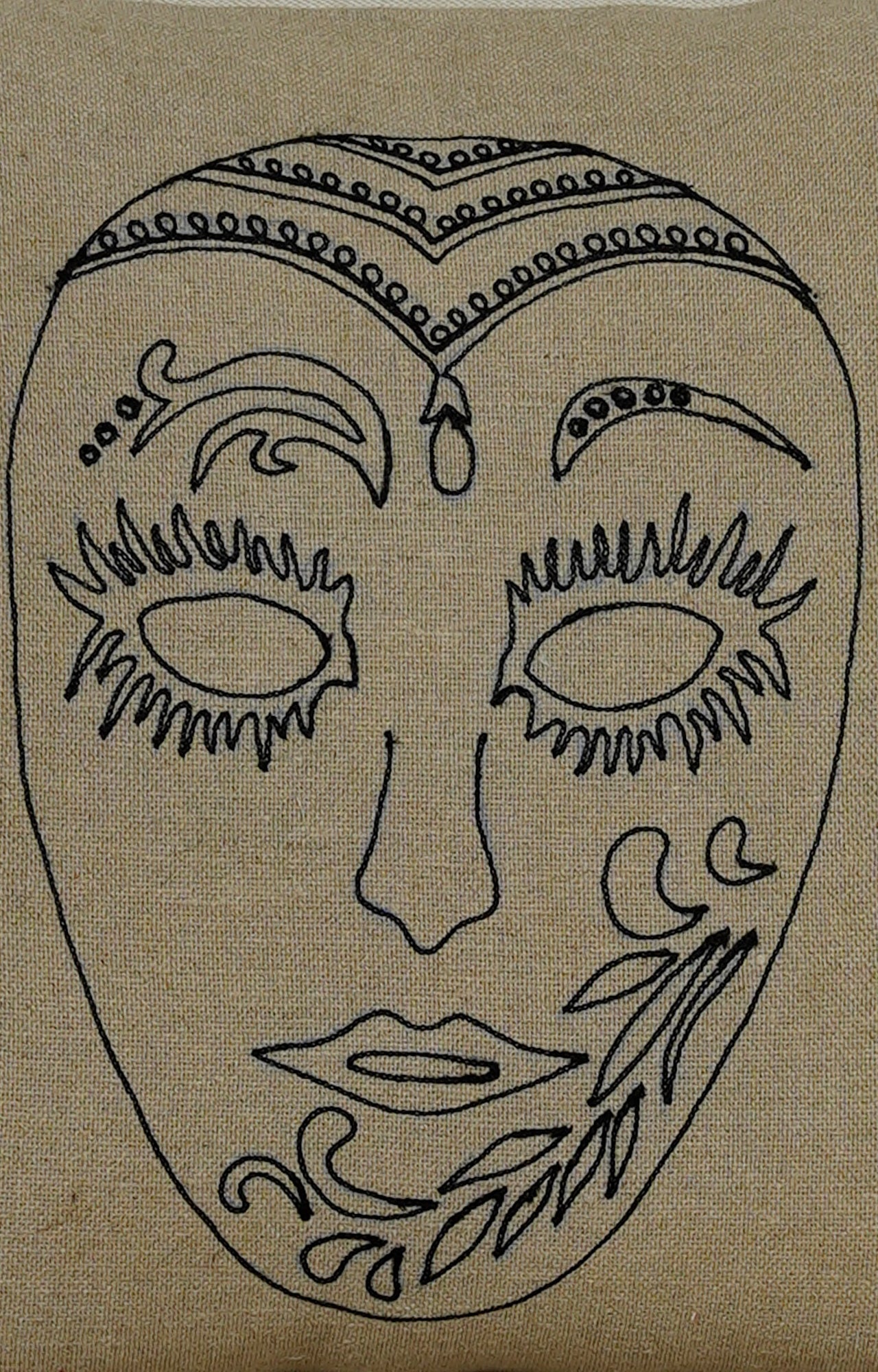 Embroidered Mask Motif Cushion with Tassels