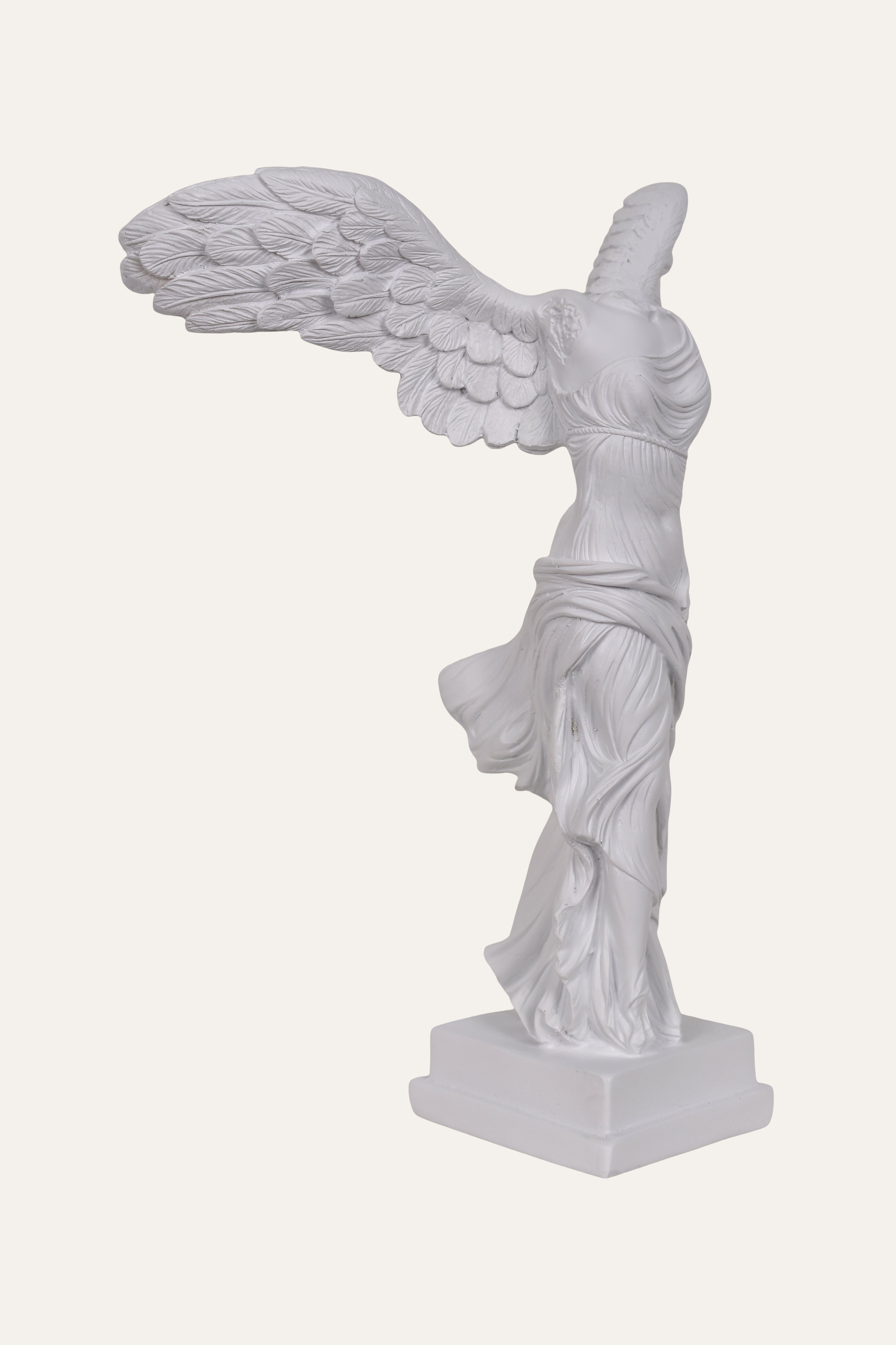 White statue of a winged figure