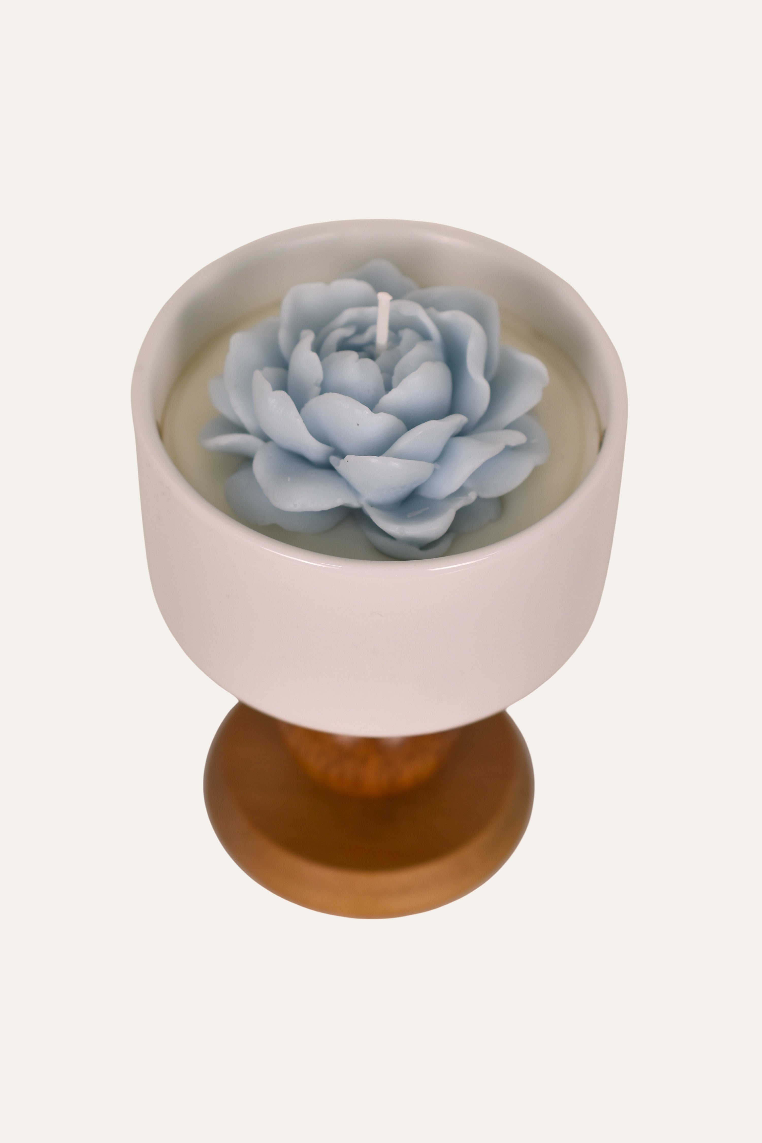Decorative candle in flower shape