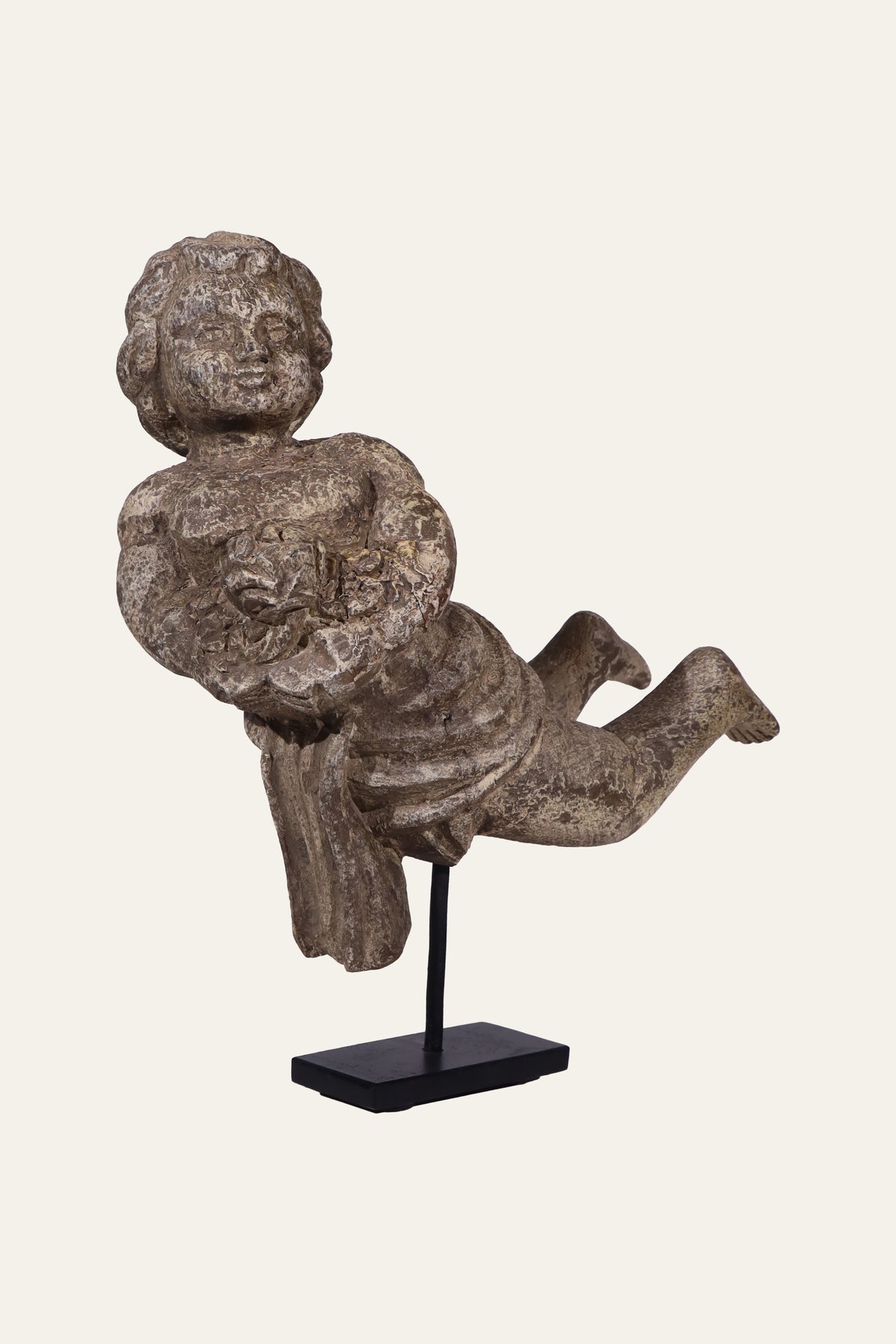 Cherub angel statue on display stand