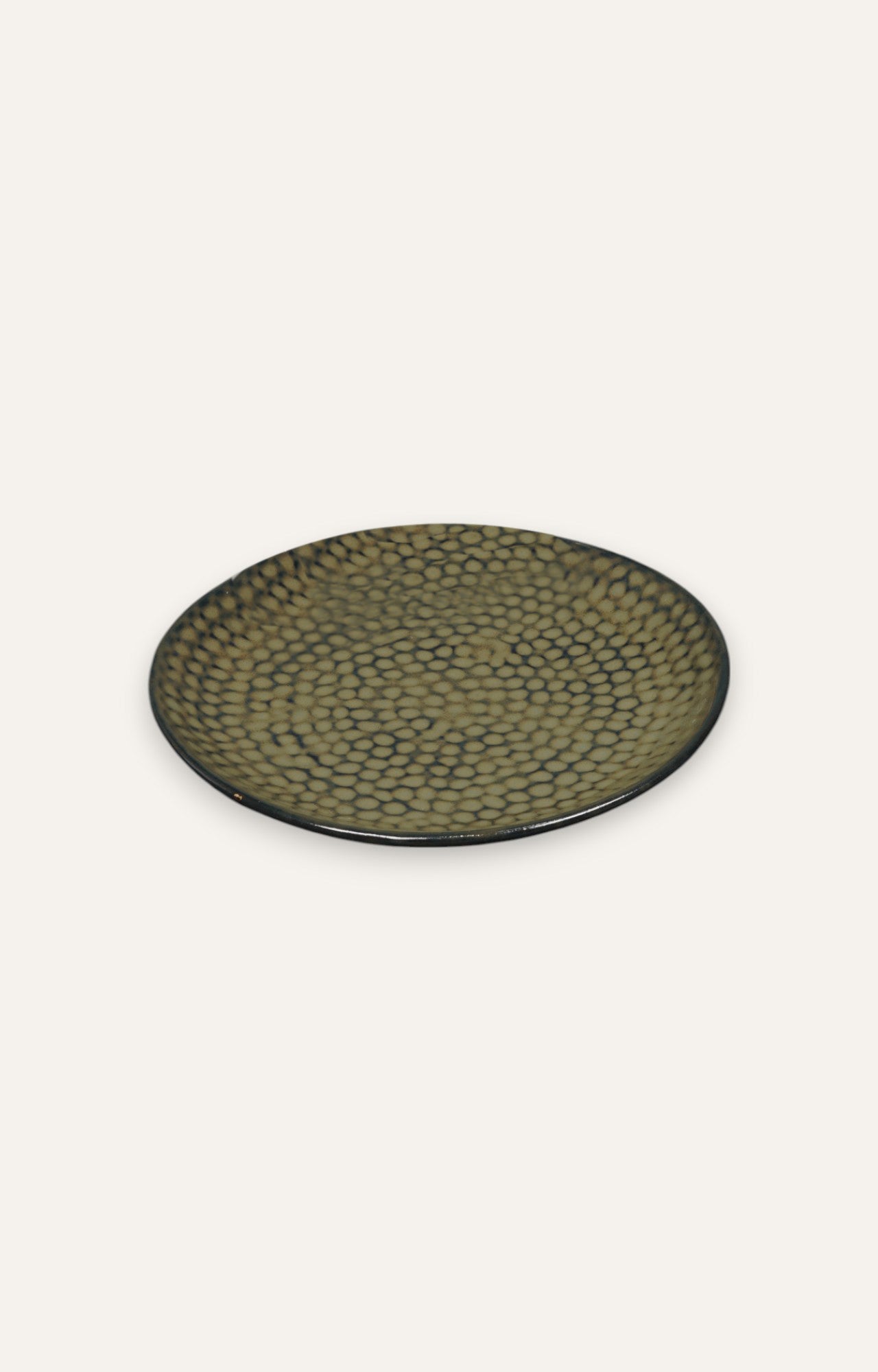 Ceramic dinner plate with speckled stone-glazed surface