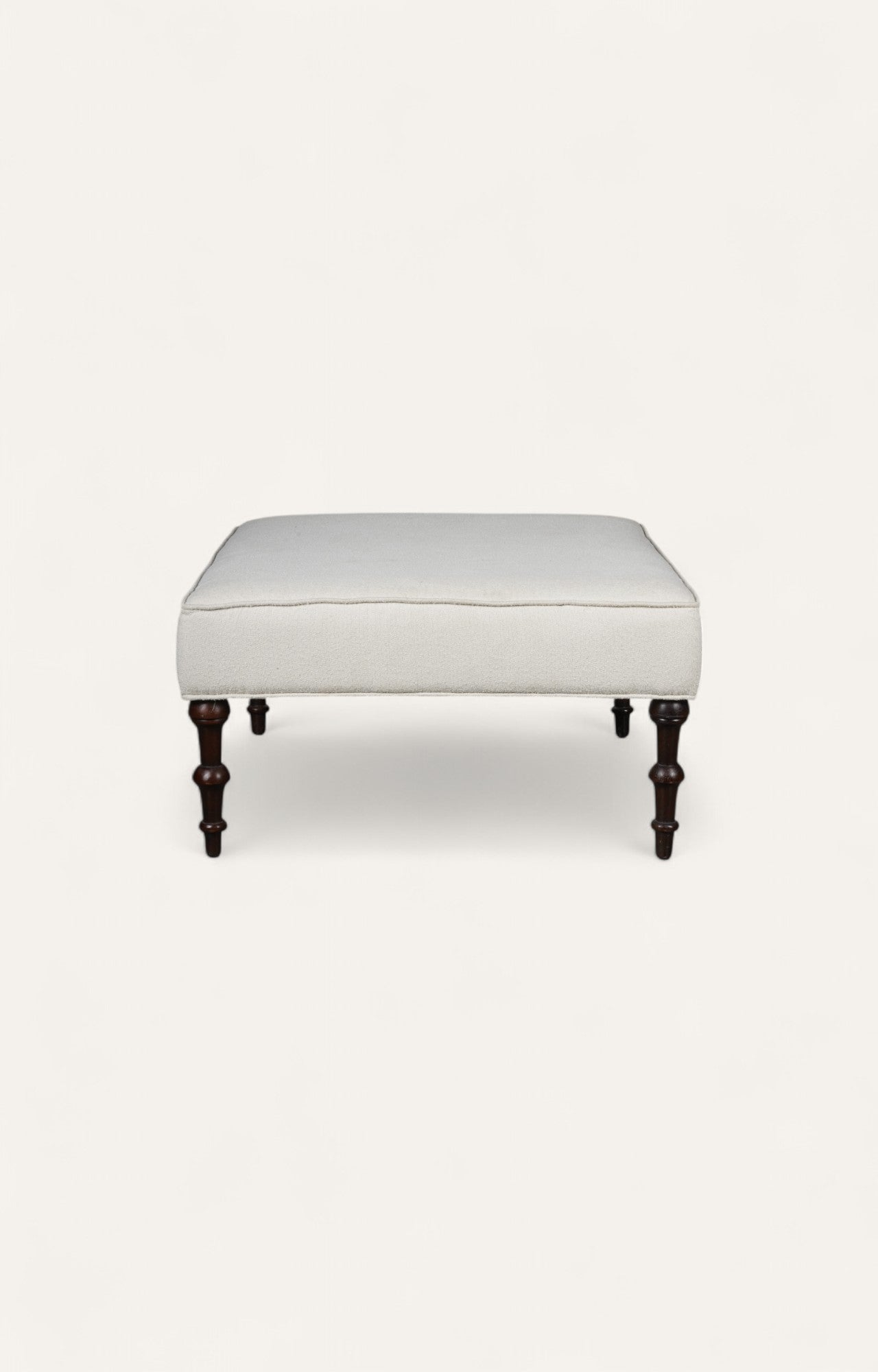 Traditional Ottoman with Cream Upholstery and Dark Turned Legs