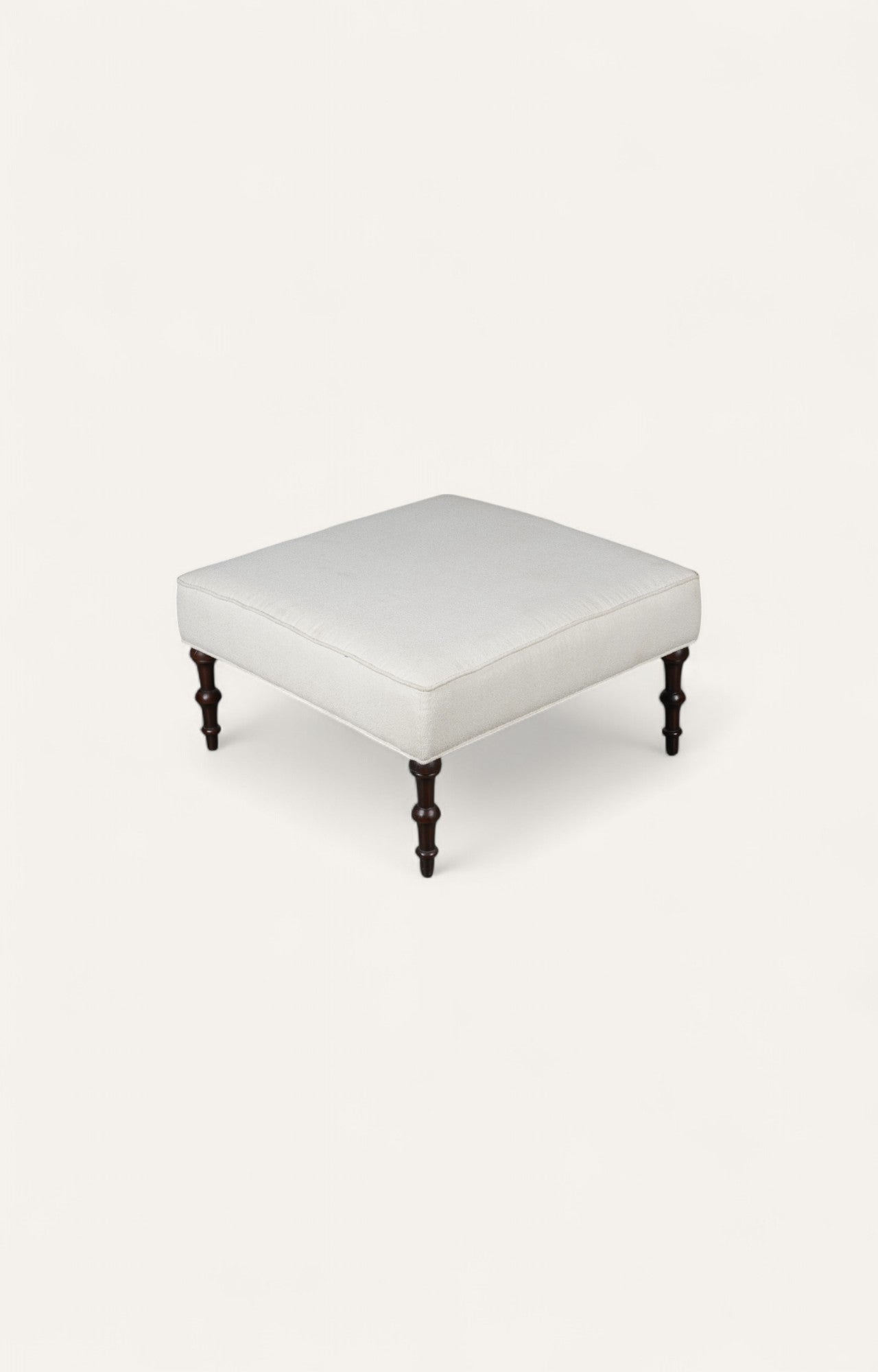 Traditional Ottoman with Cream Upholstery and Dark Turned Legs
