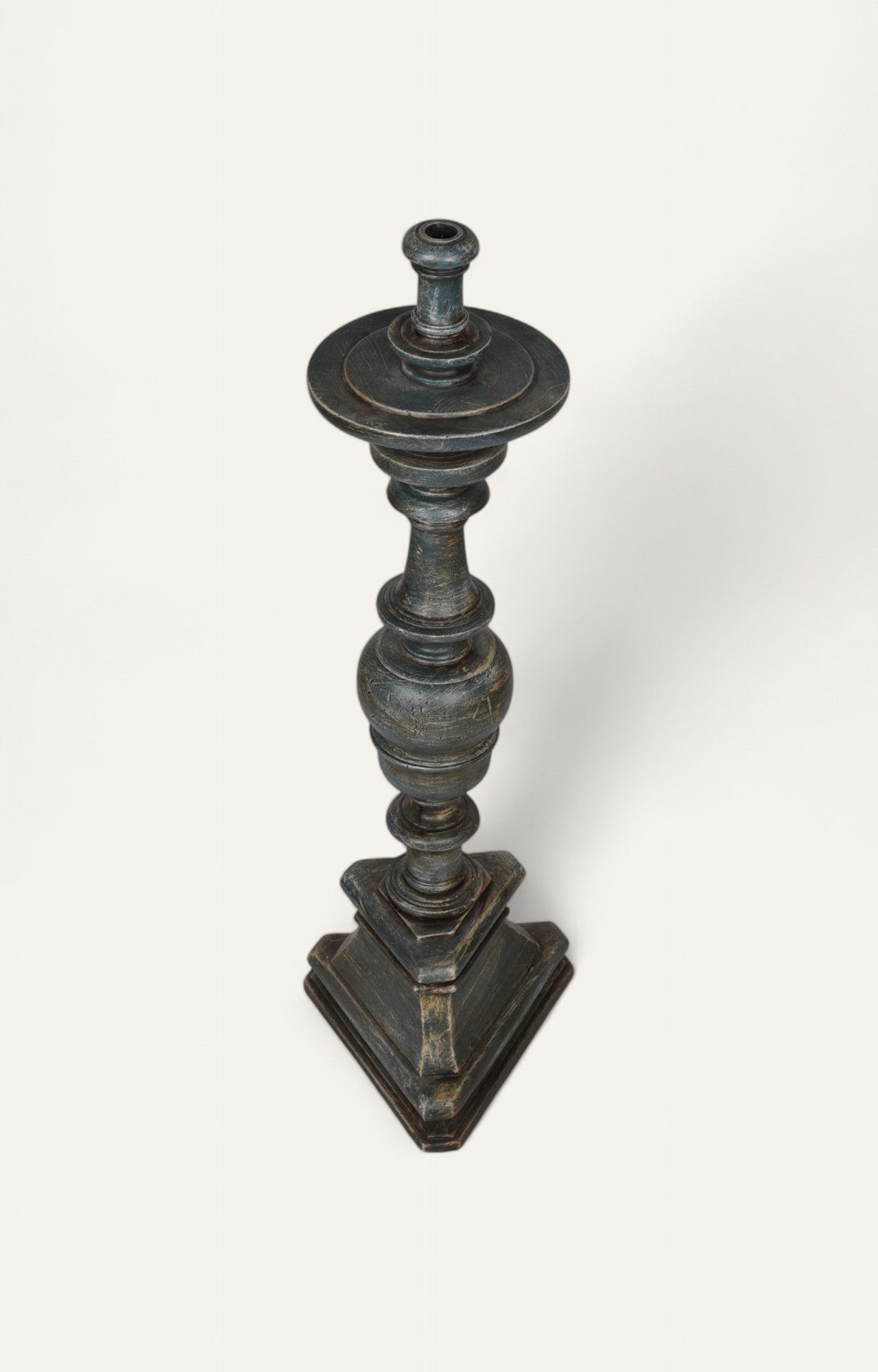 Ebony-finished turned teak floor candle holder with classic stepped base