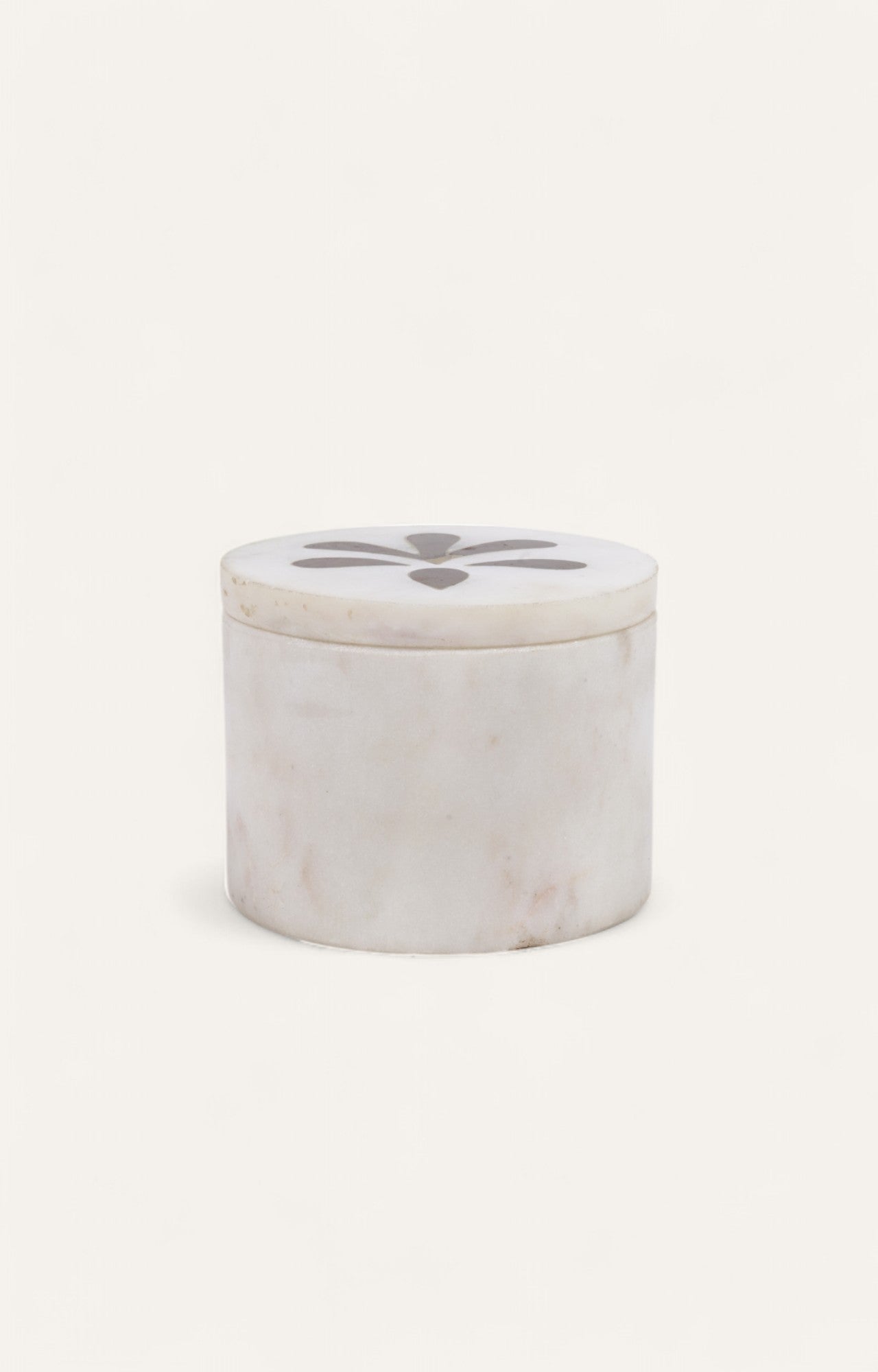 Small round white marble box with floral brass inlay on lid