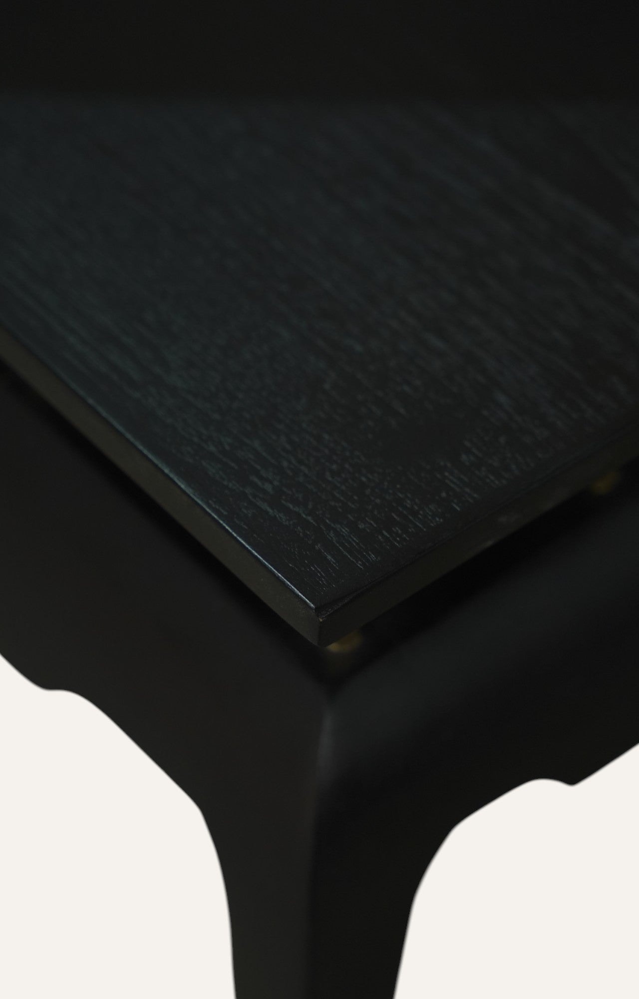 Black Sculpted Accent Table with Brass Detailing