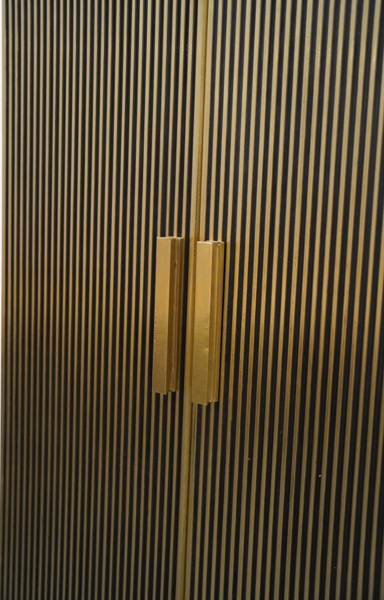 Tall Brass-Clad Cabinet with Iron Legs