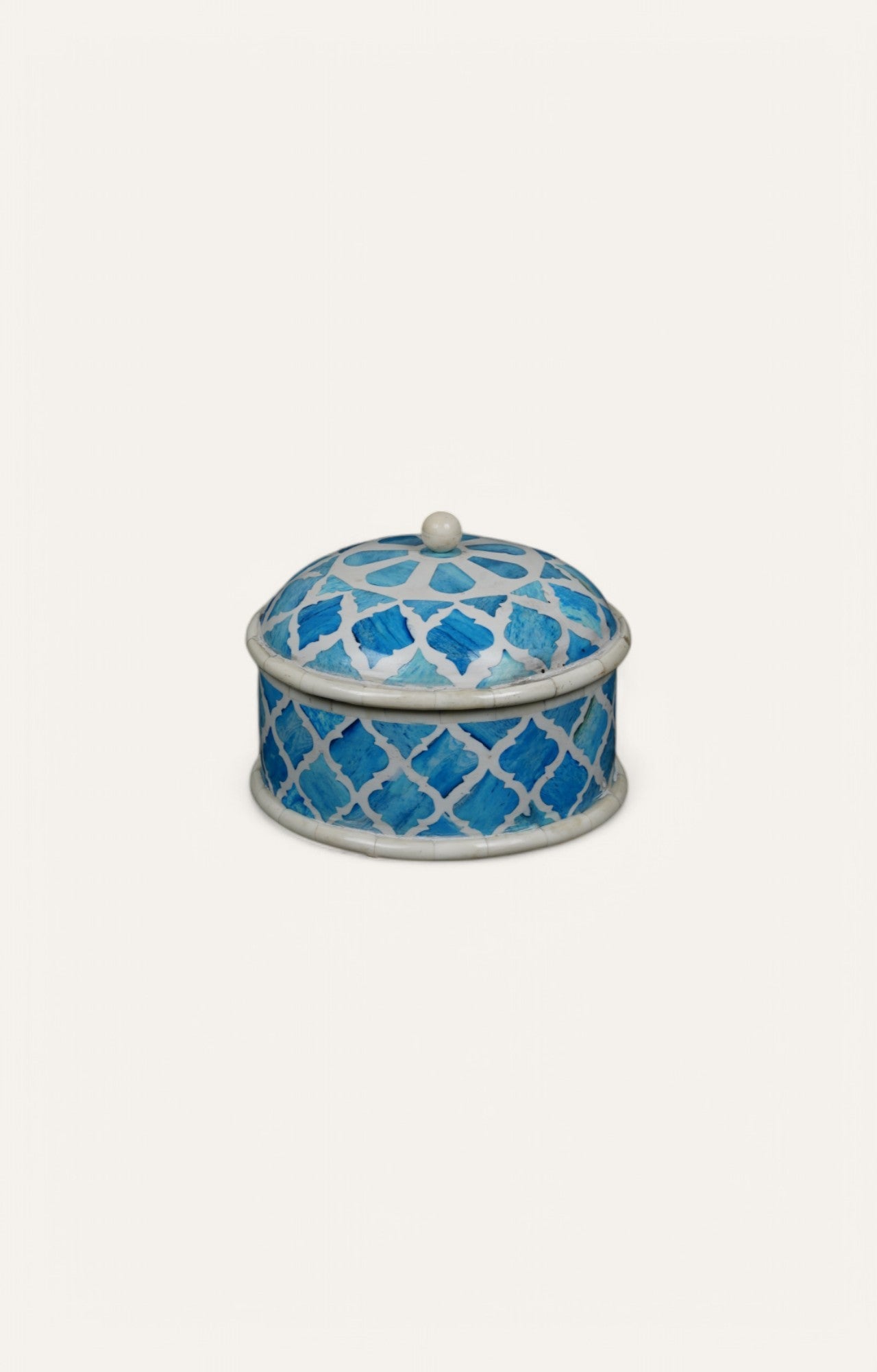 Round blue and white box with bone inlay and dome-shaped lid.