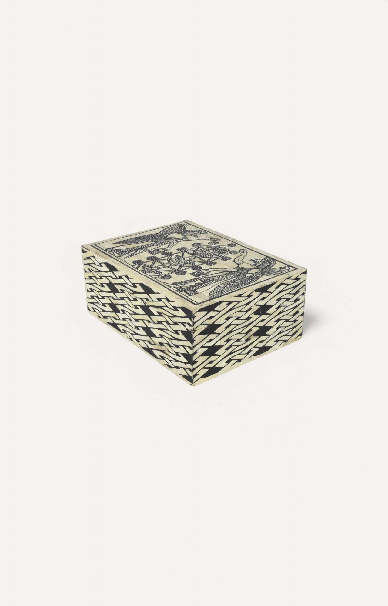Large ivory-toned camel bone box with black painted deities and brick pattern sides.