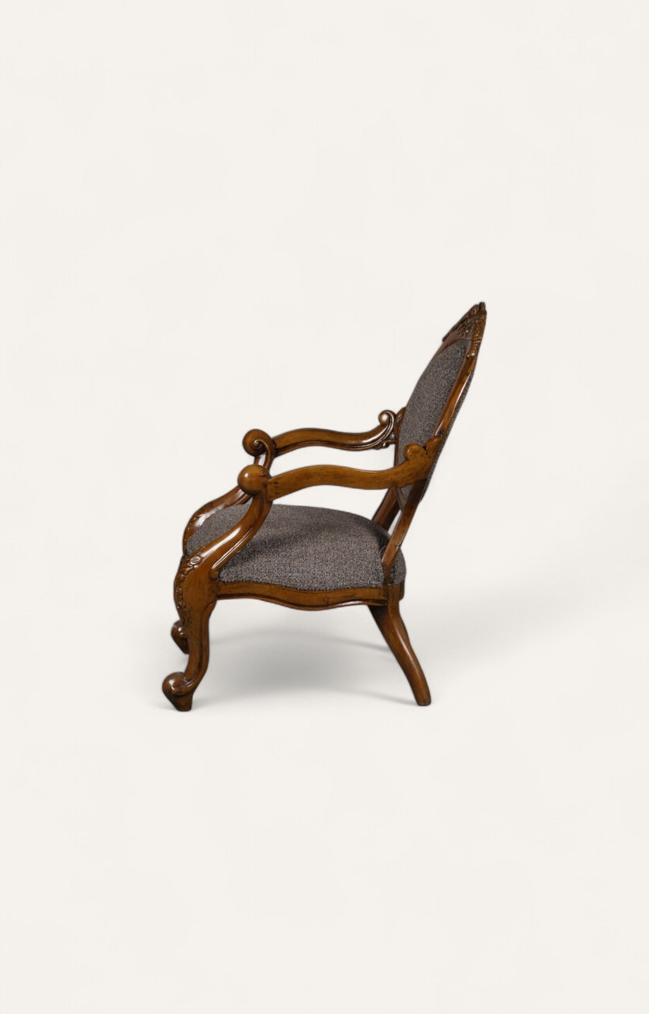 Victorian style teak wood armchair in dark oak
