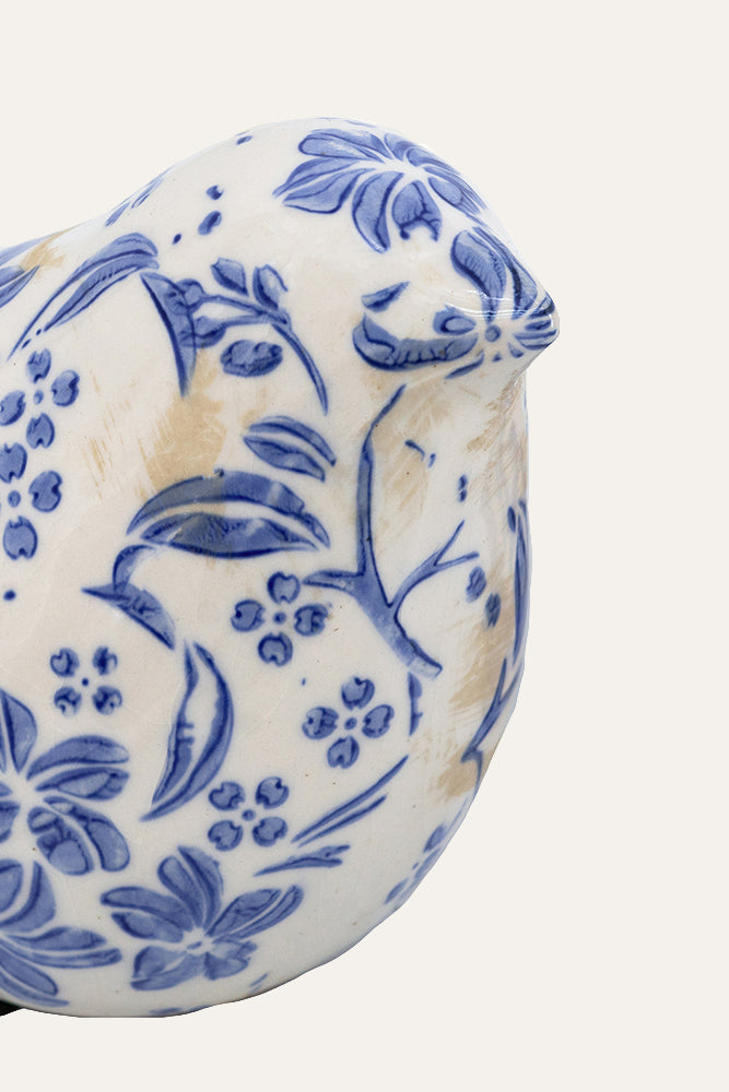 Ceramic bird with blue floral patterns