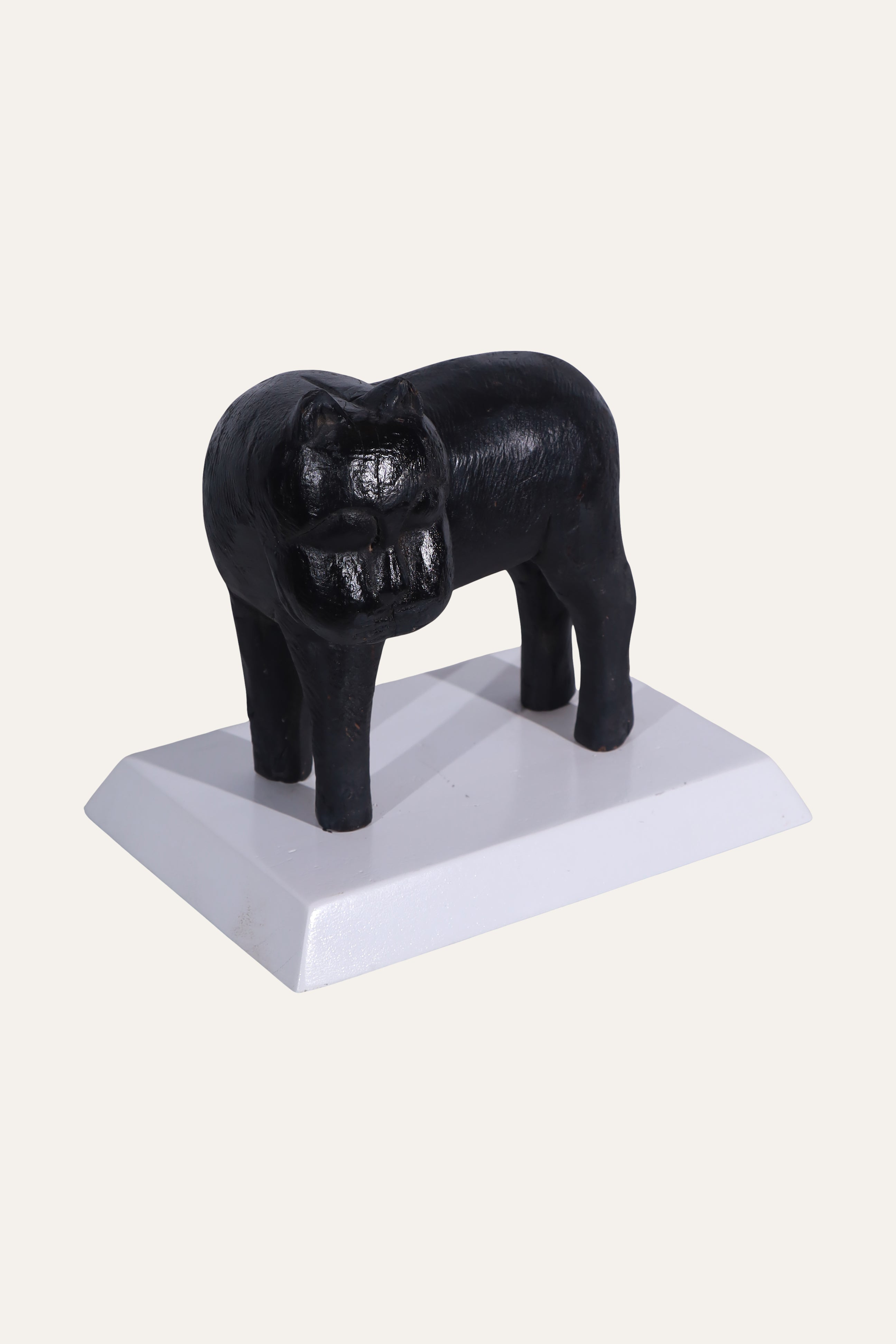 Black Animal Sculpture on White Display Base