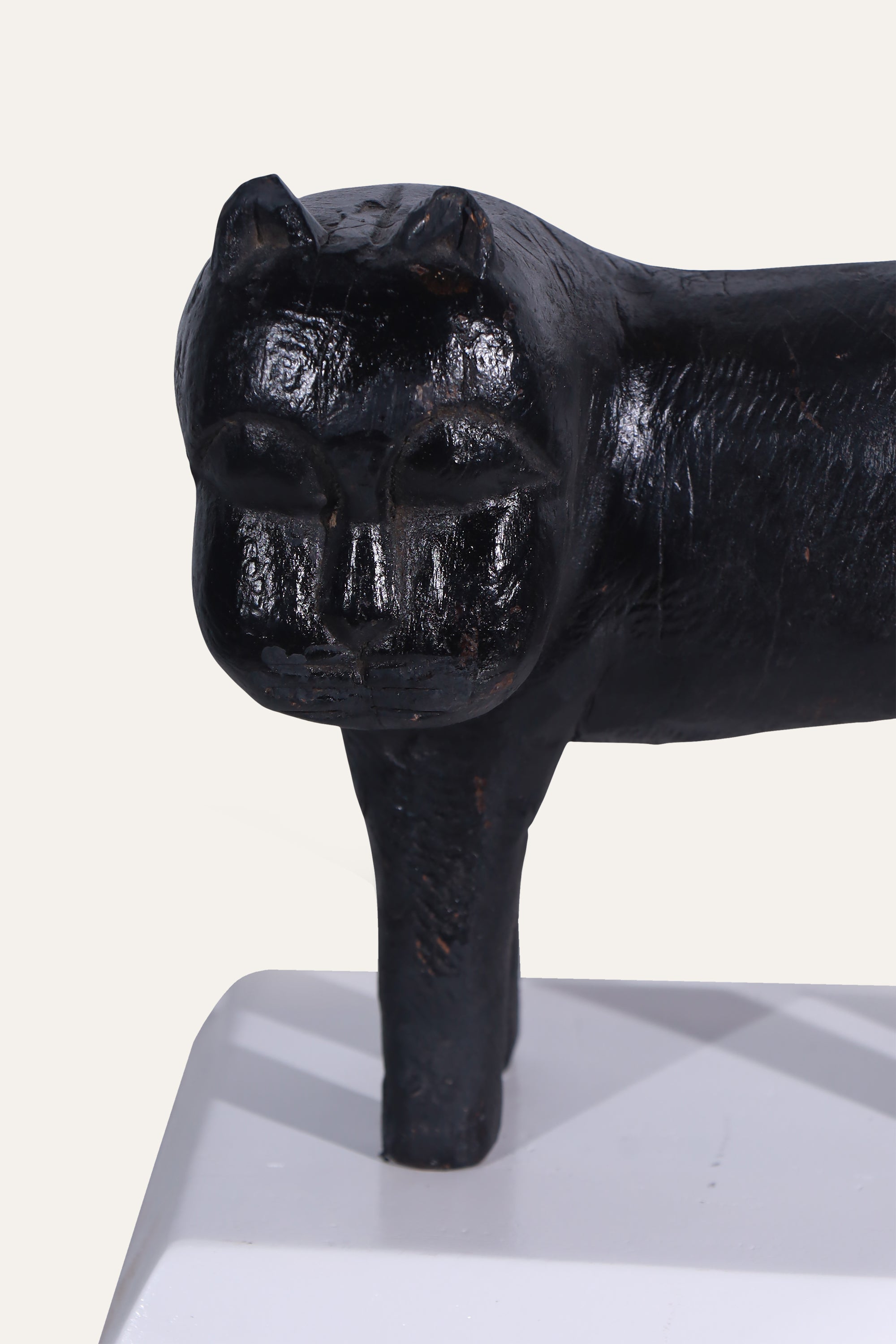 Black Animal Sculpture on White Display Base