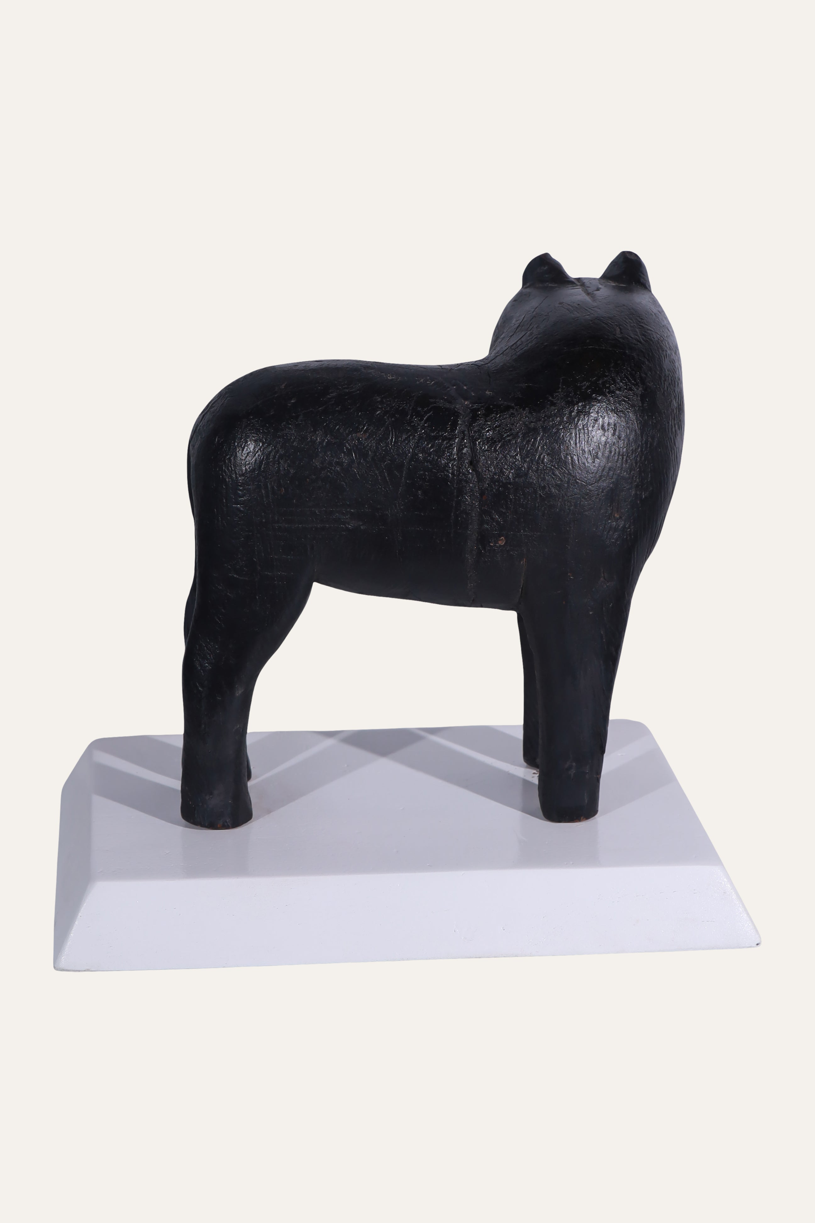 Black Animal Sculpture on White Display Base