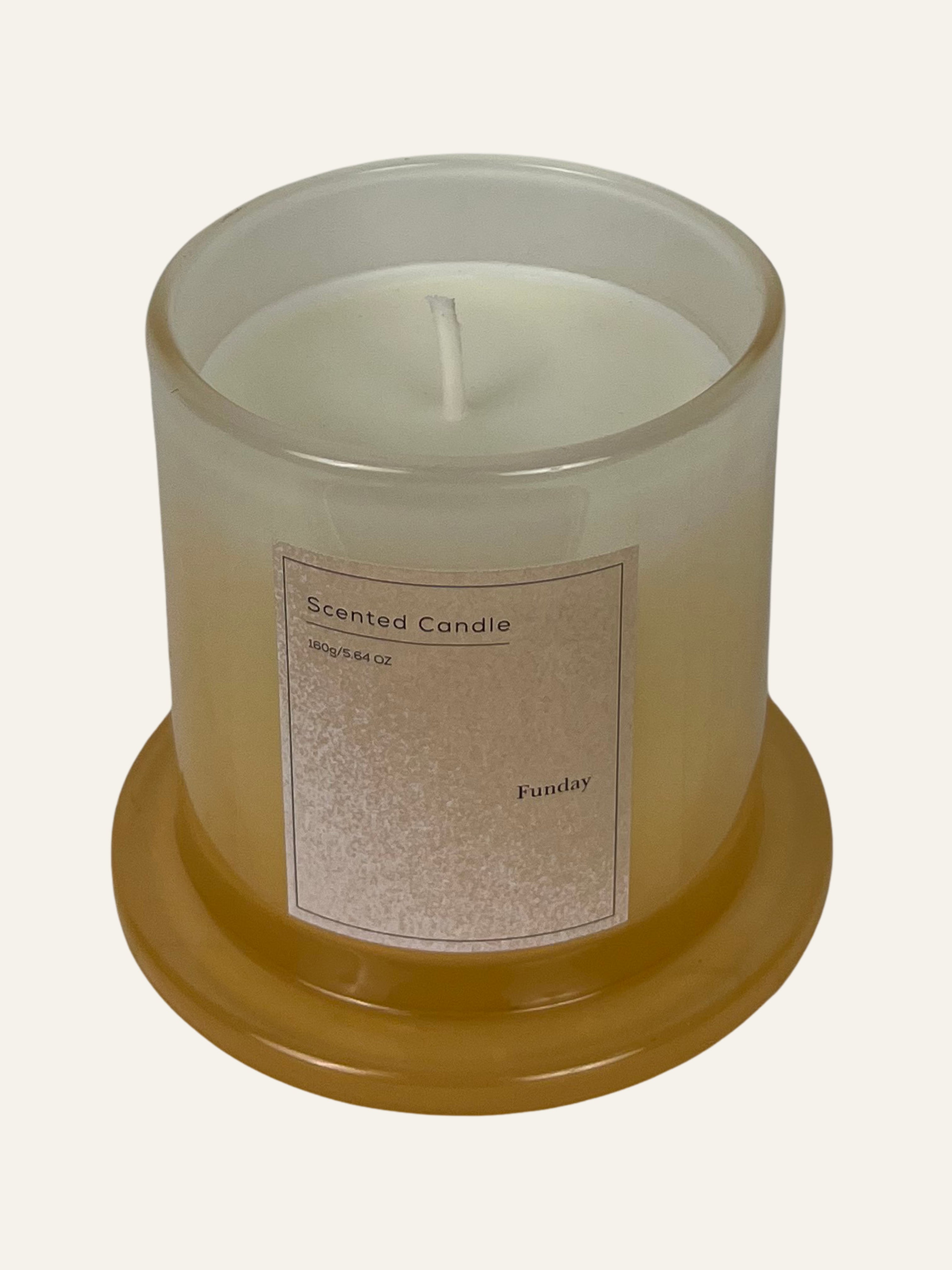 Scented candle in a clear glass jar