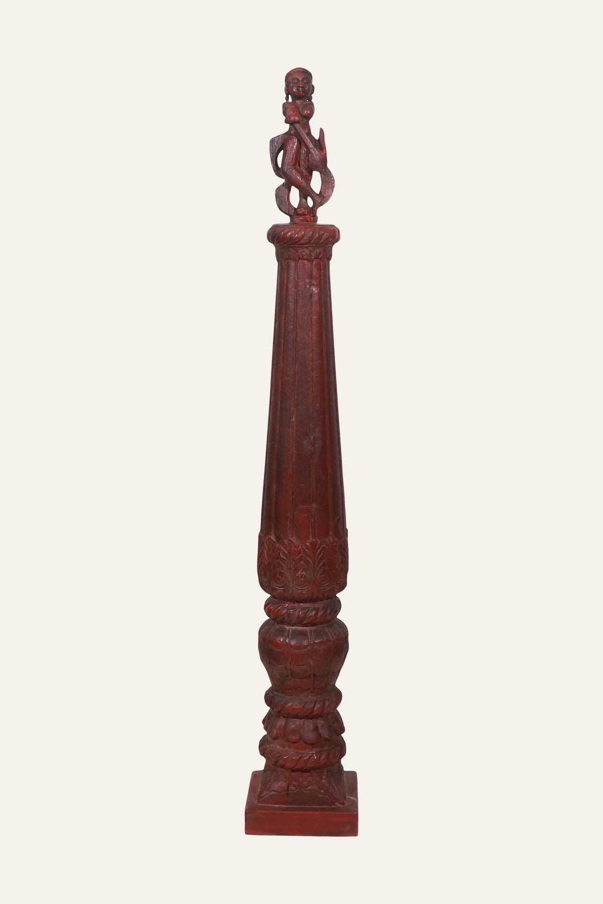 Carved Deity Figure on Red Terracotta Column