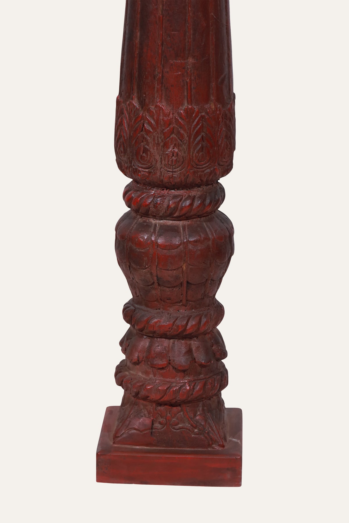 Carved Deity Figure on Red Terracotta Column