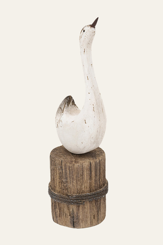 Minimalistic swan figurine on groyne
