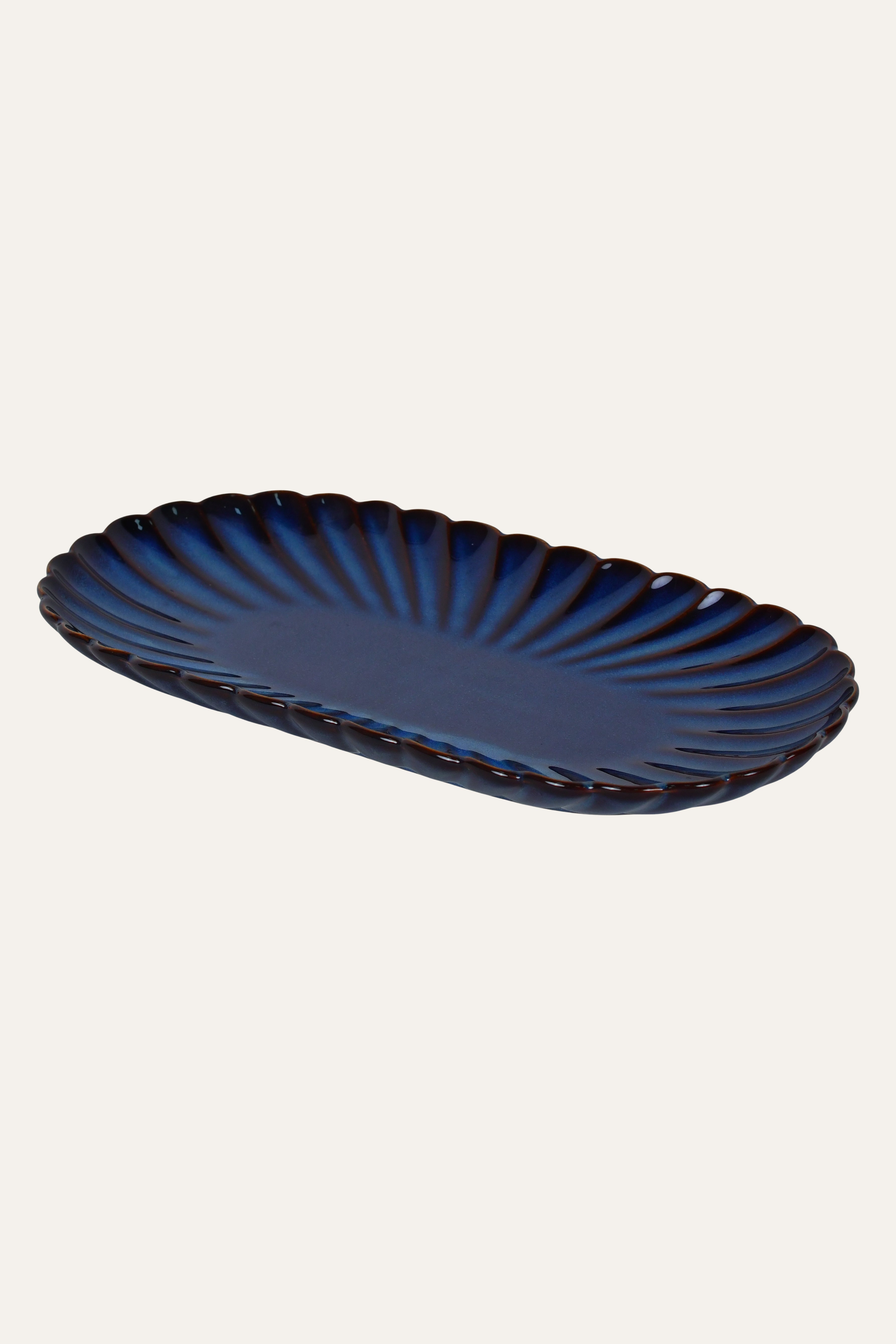 Oval ribbed ceramic platter for serving food