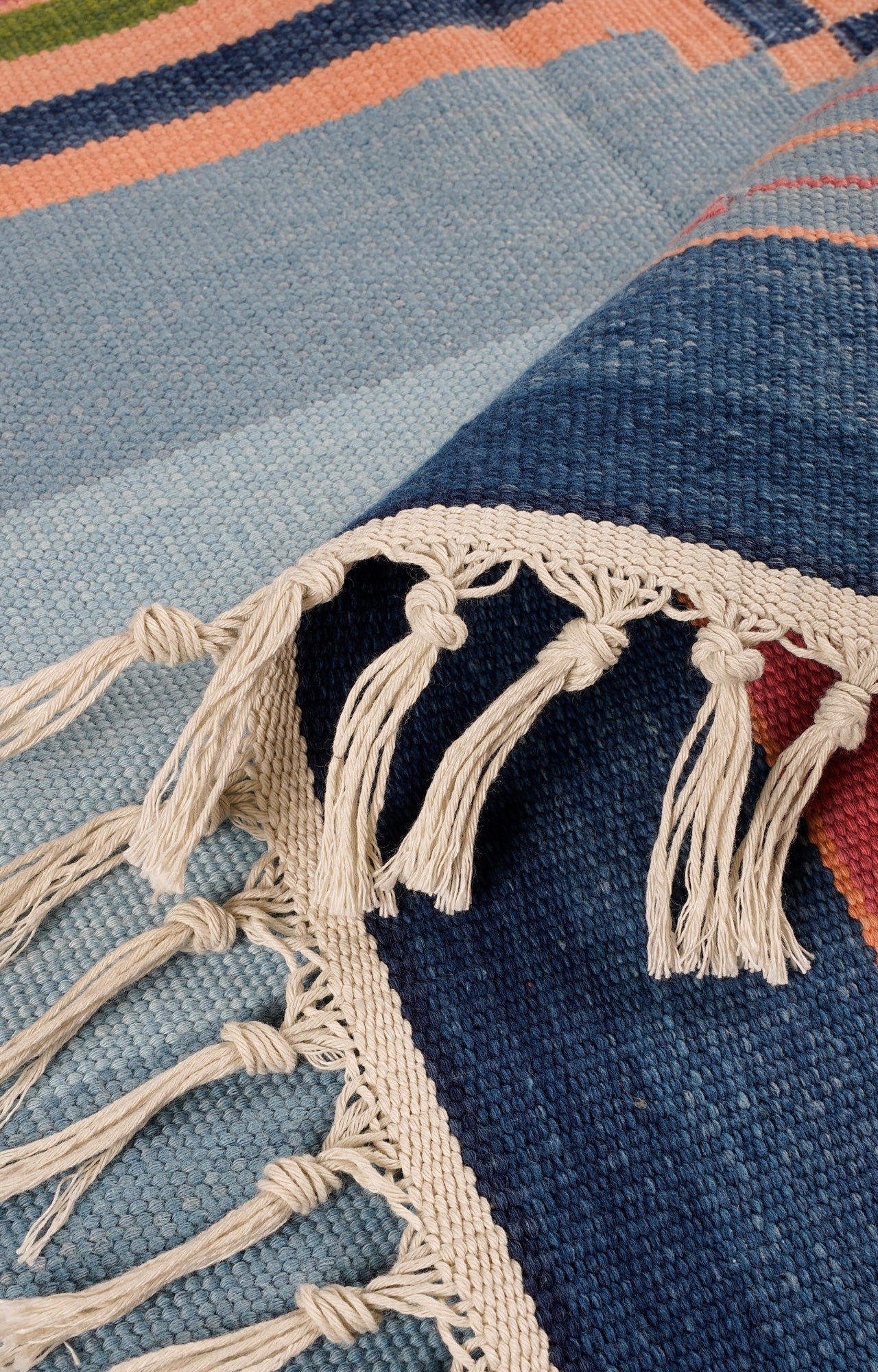 colorful woven rug with tassels