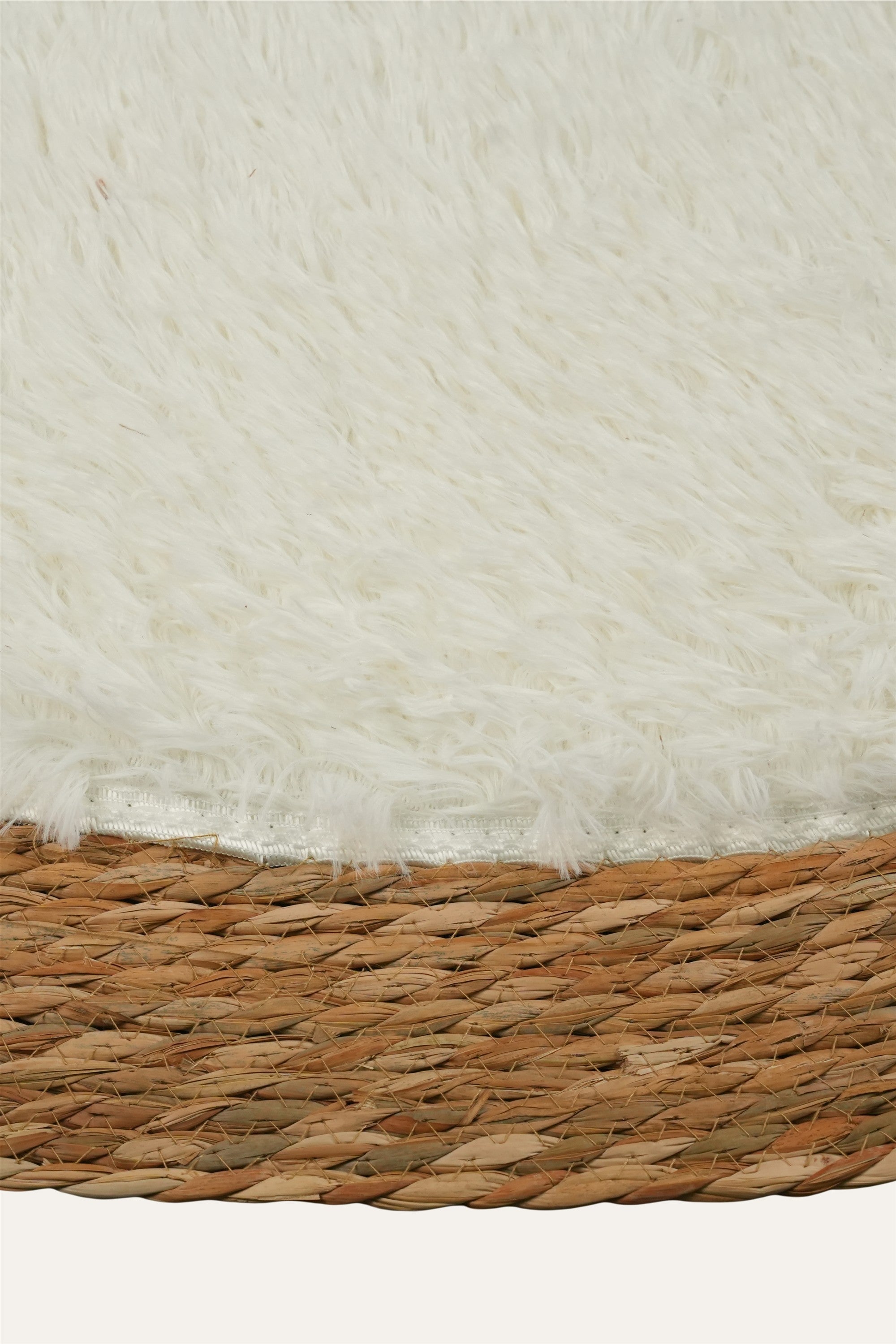 Round woven rug with cream and brown border