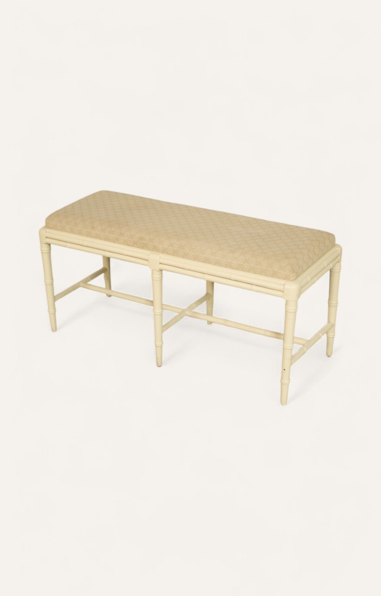 cream-painted wooden bench