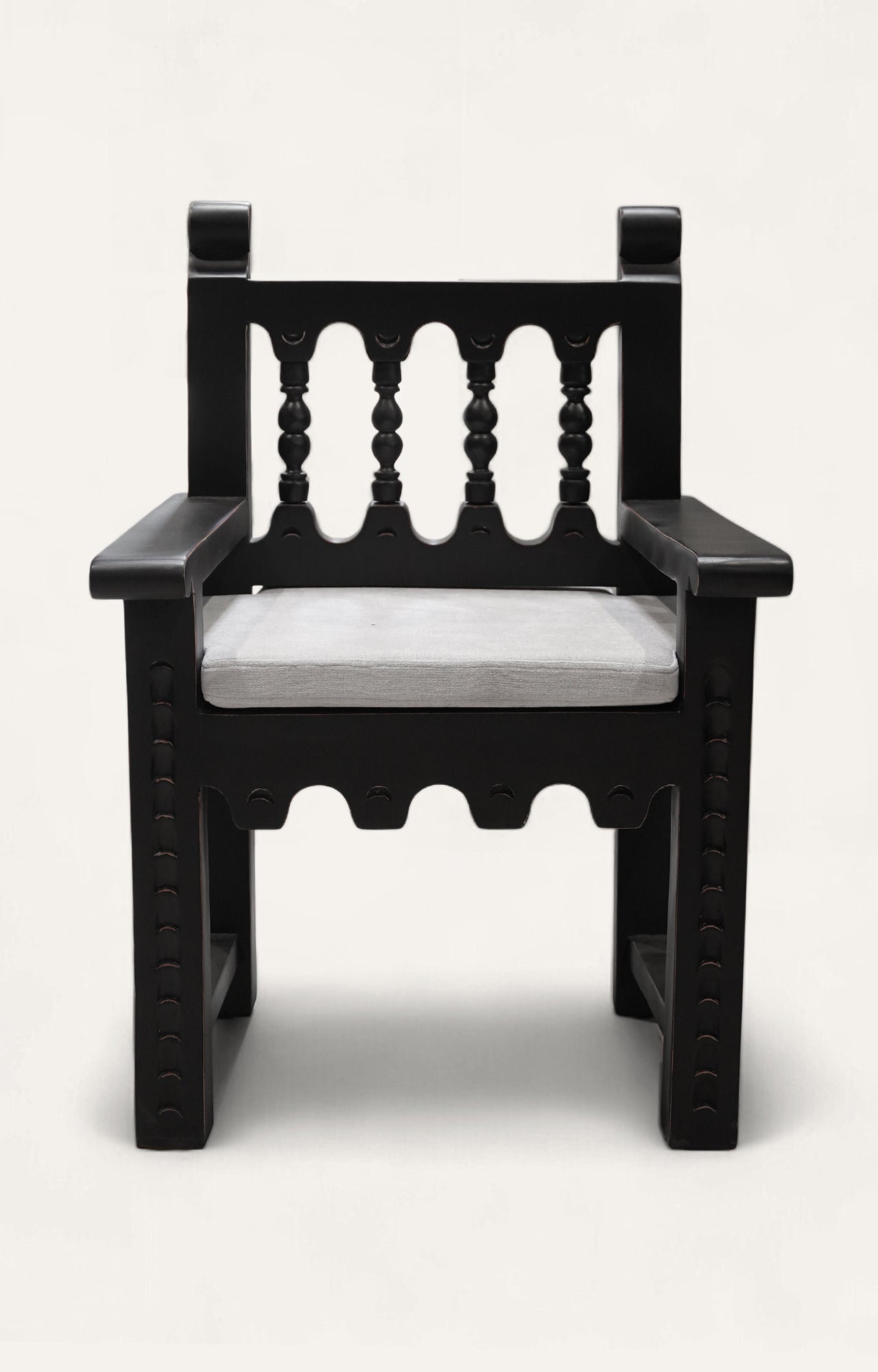 Black chair with white cushion