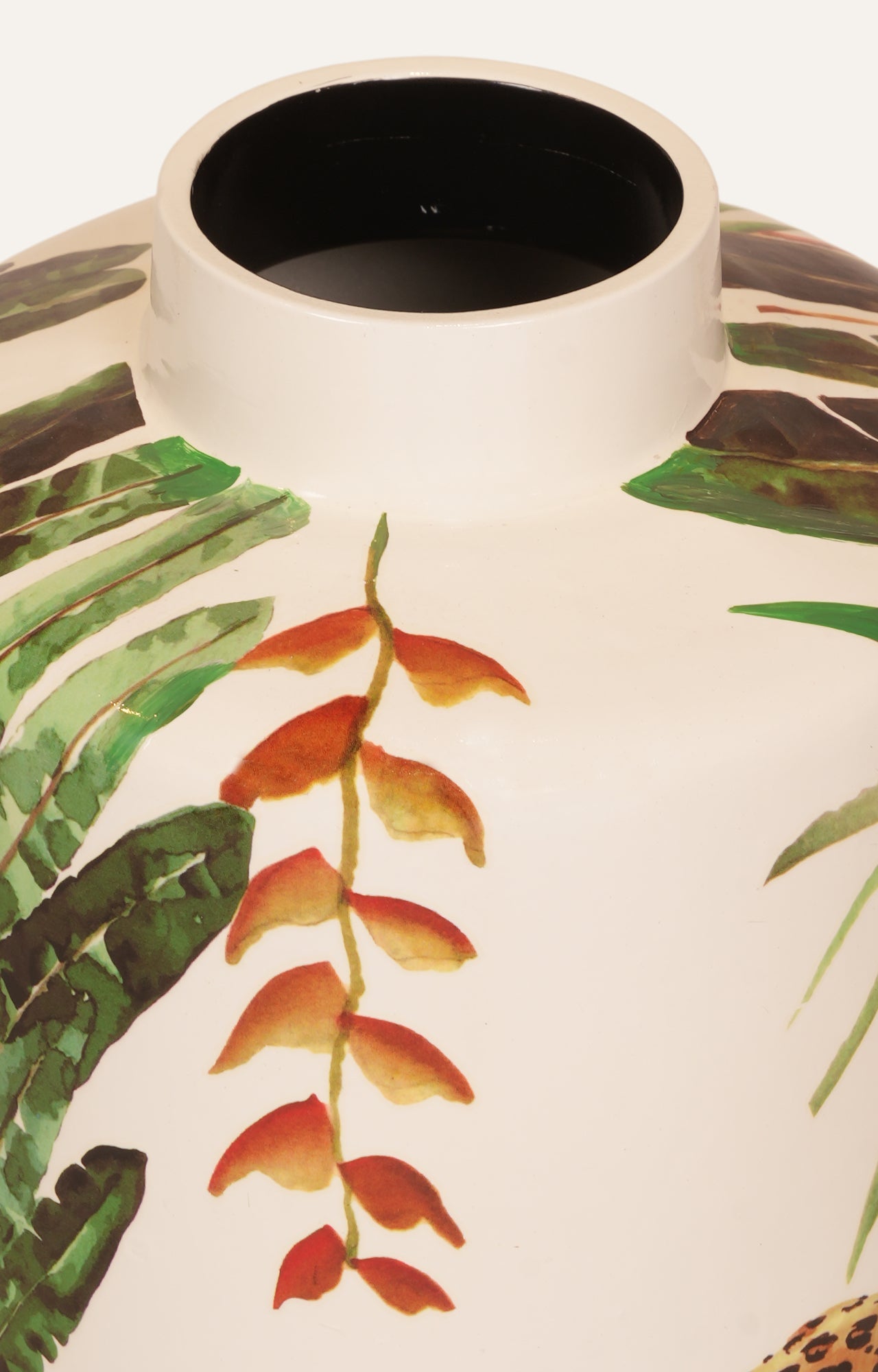 Vase with tropical leaf