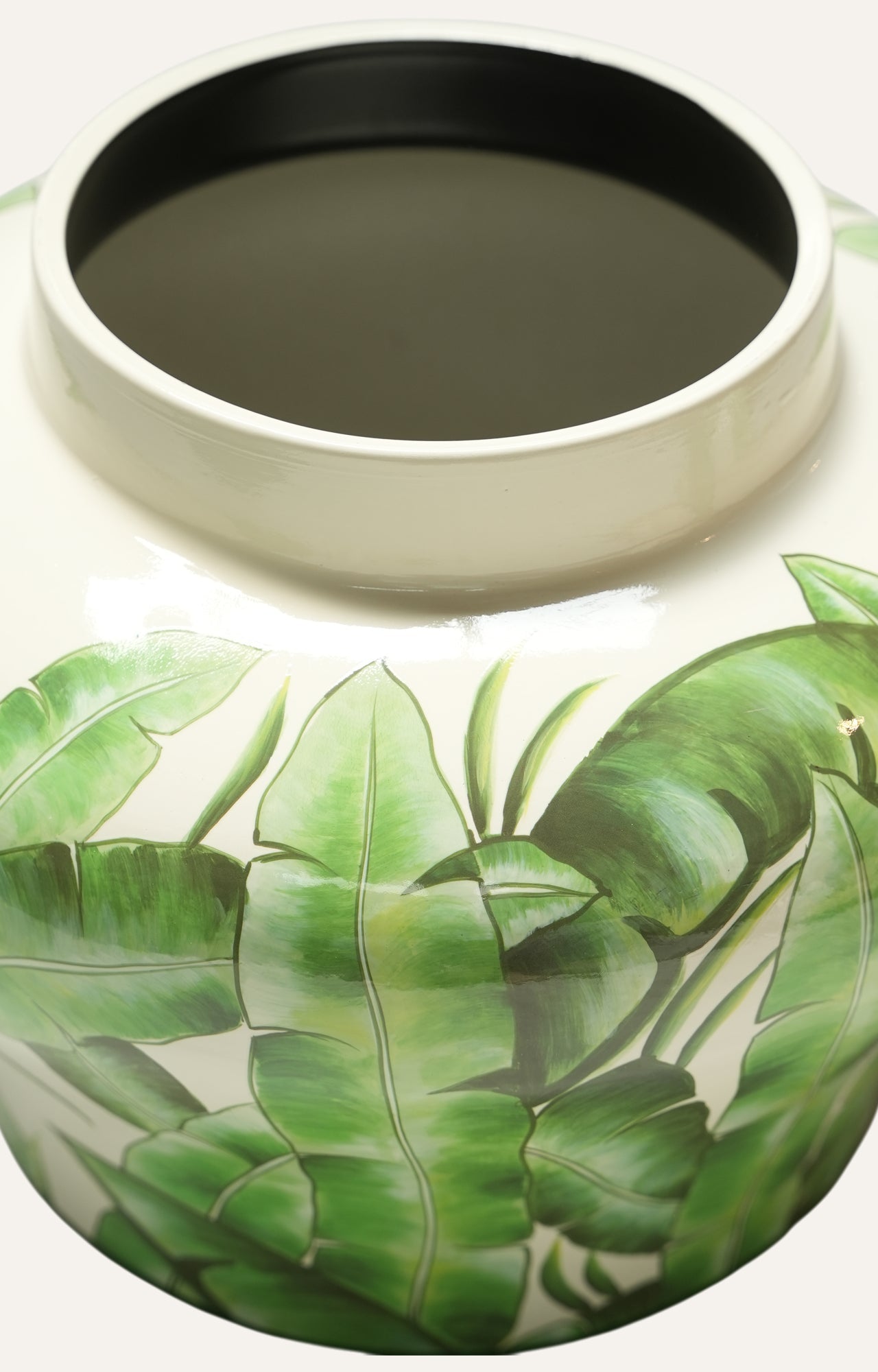 Ceramic jar with green leaf
