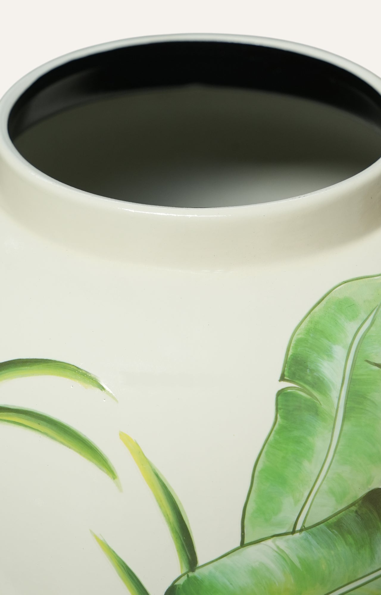 ceramic vase with green leaf design
