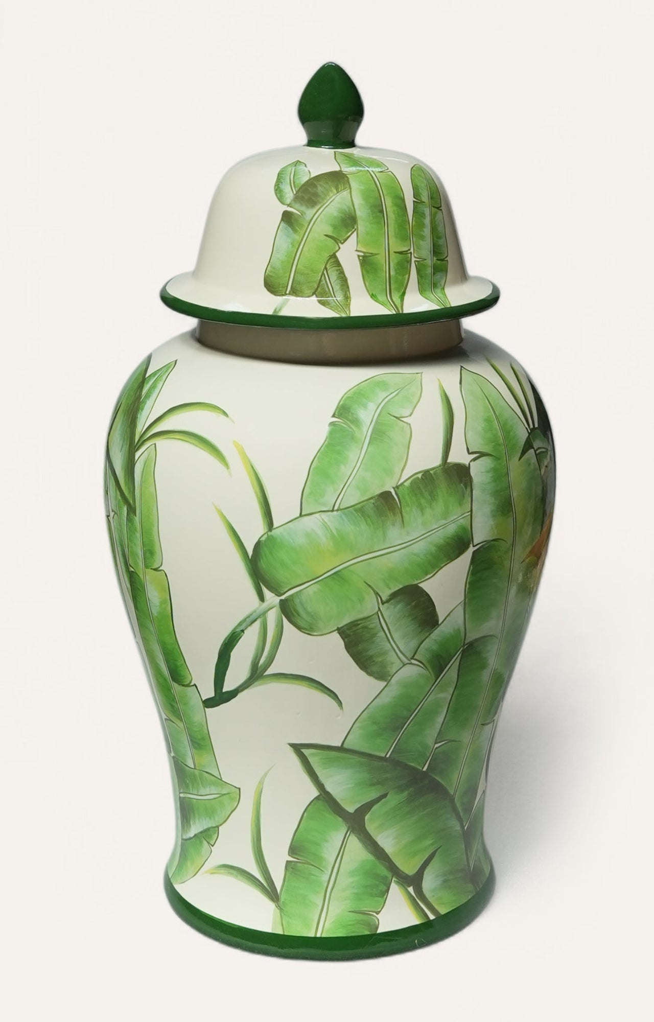 Decorative vase with green leaf patterns