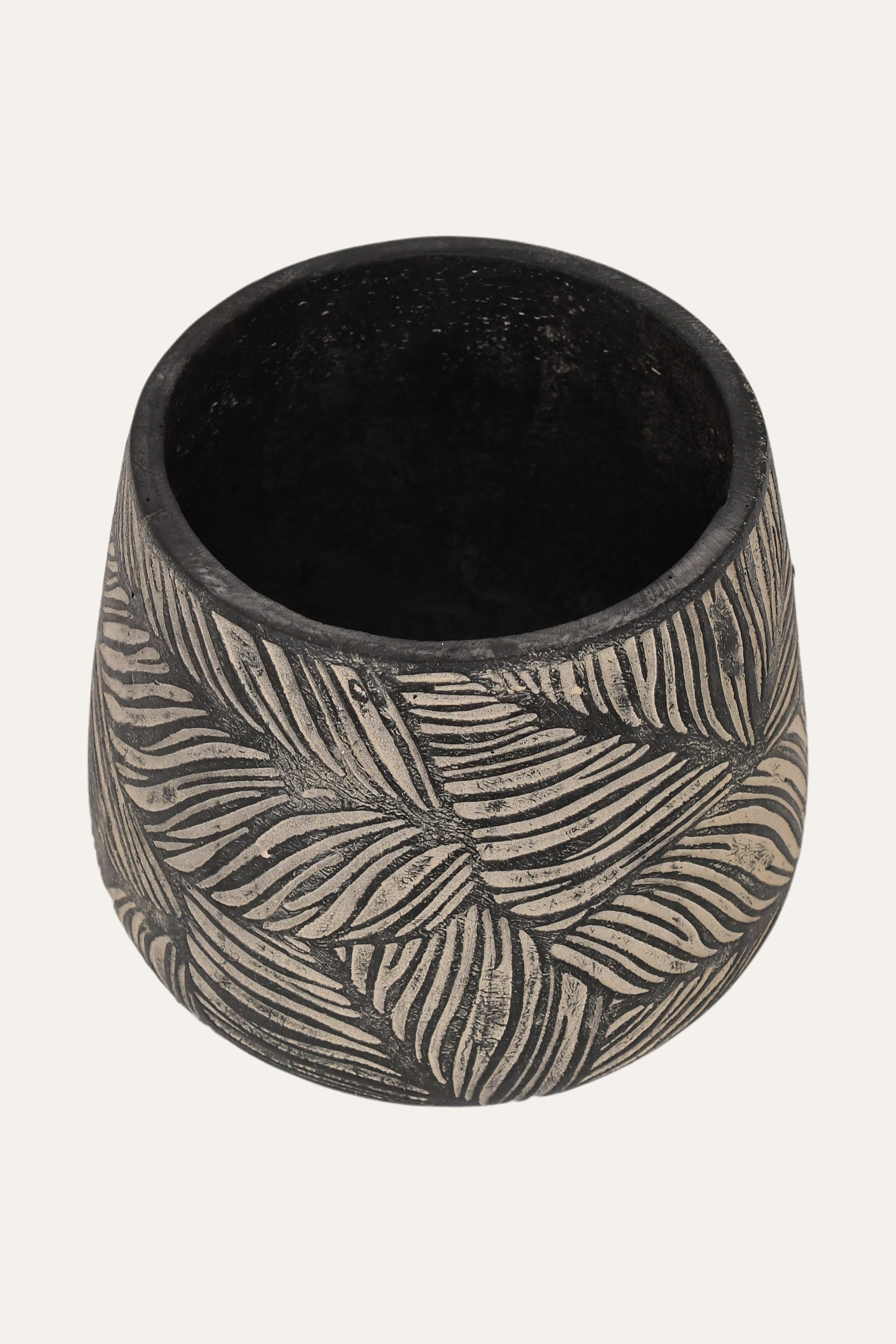 Black ceramic cup with leaf pattern