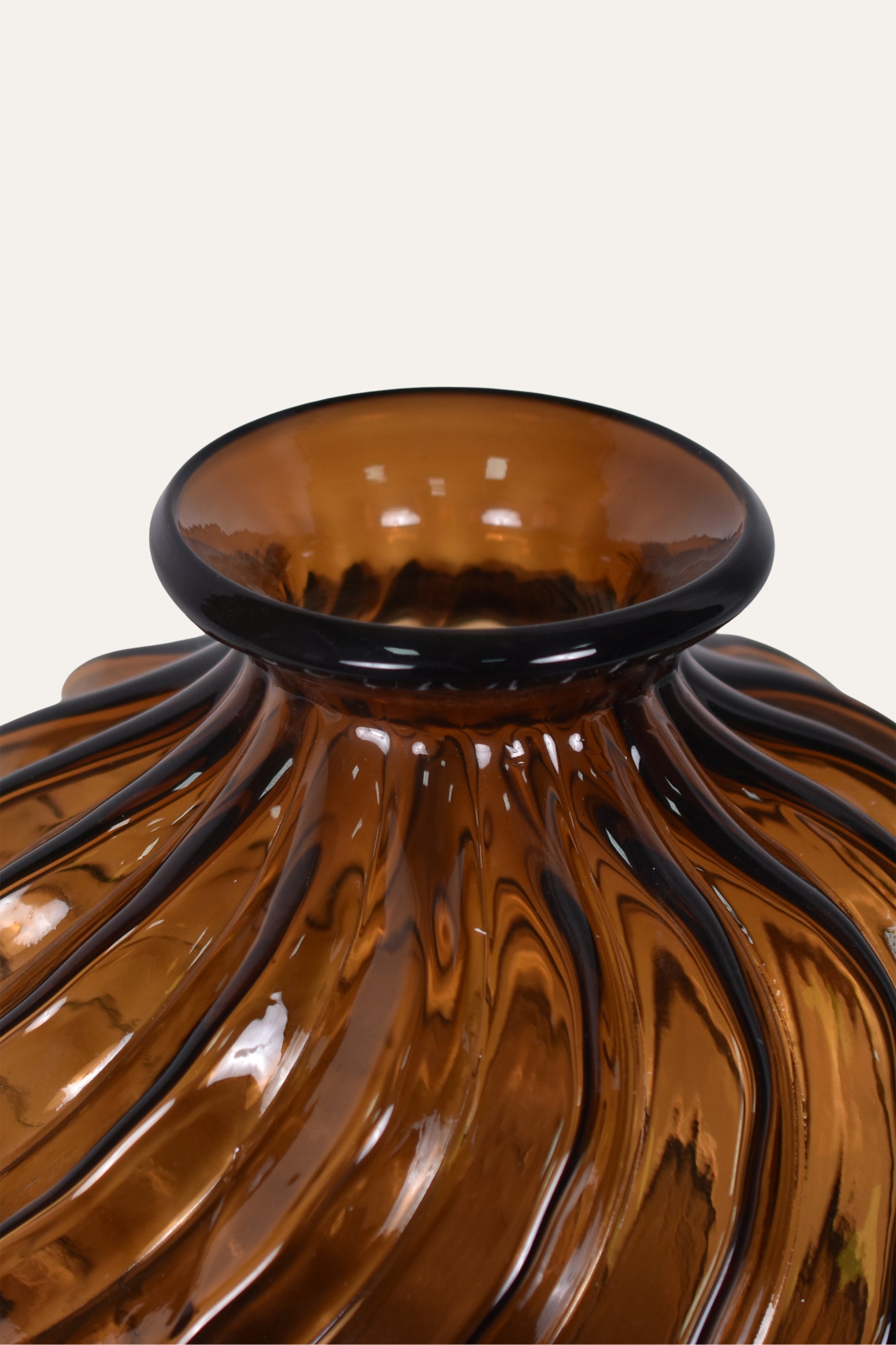 Brown glass vase with wavy design