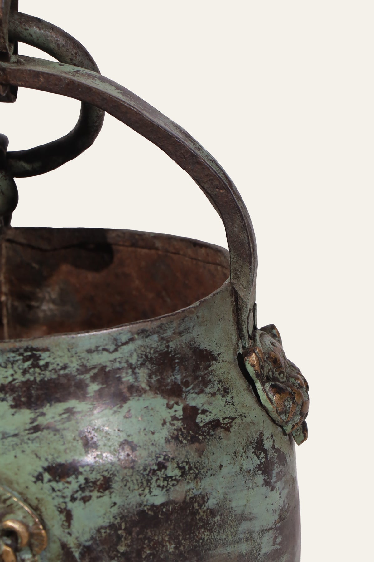 antique metal pot with lion head handles