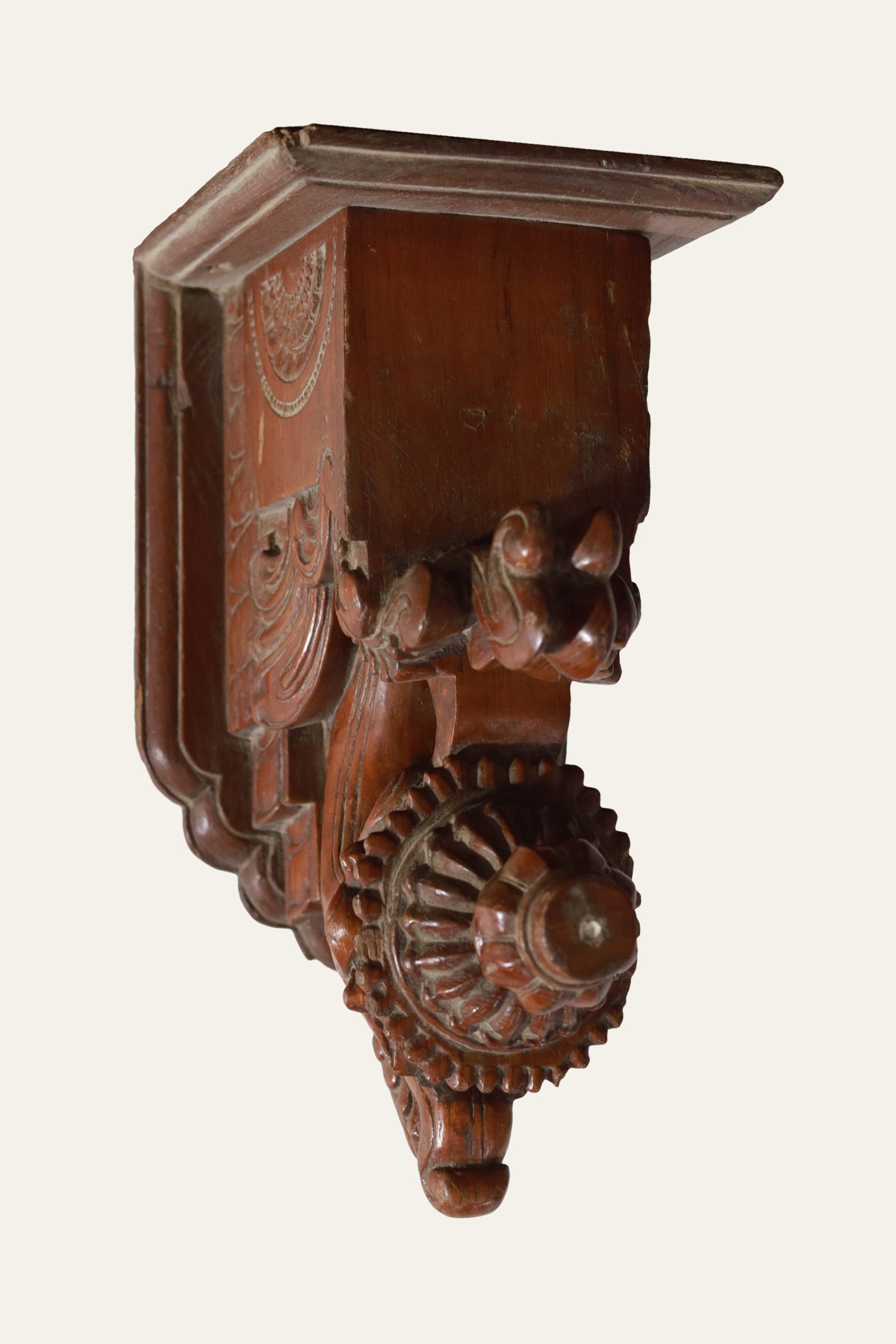 carved wooden scrollwork wall bracket