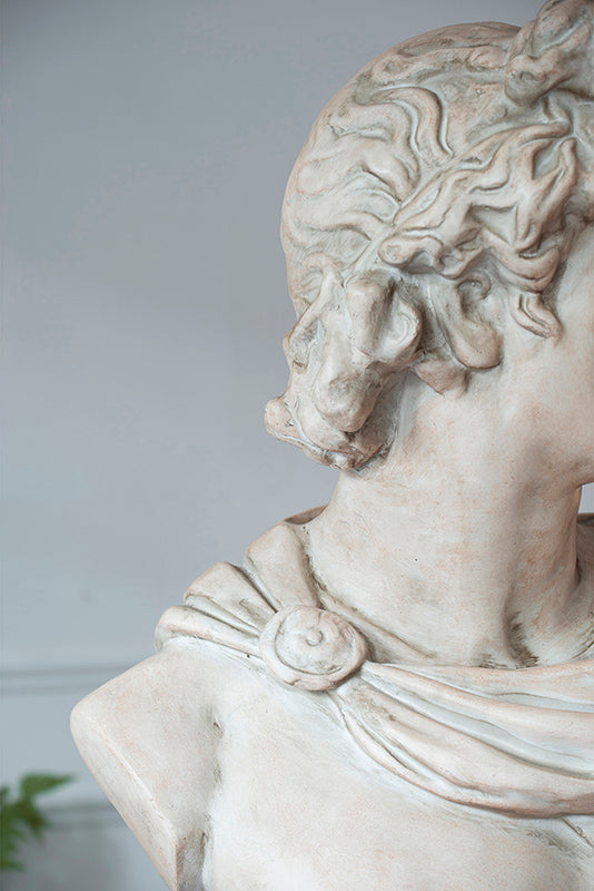 decorative Apollo sculpture on pedestal
