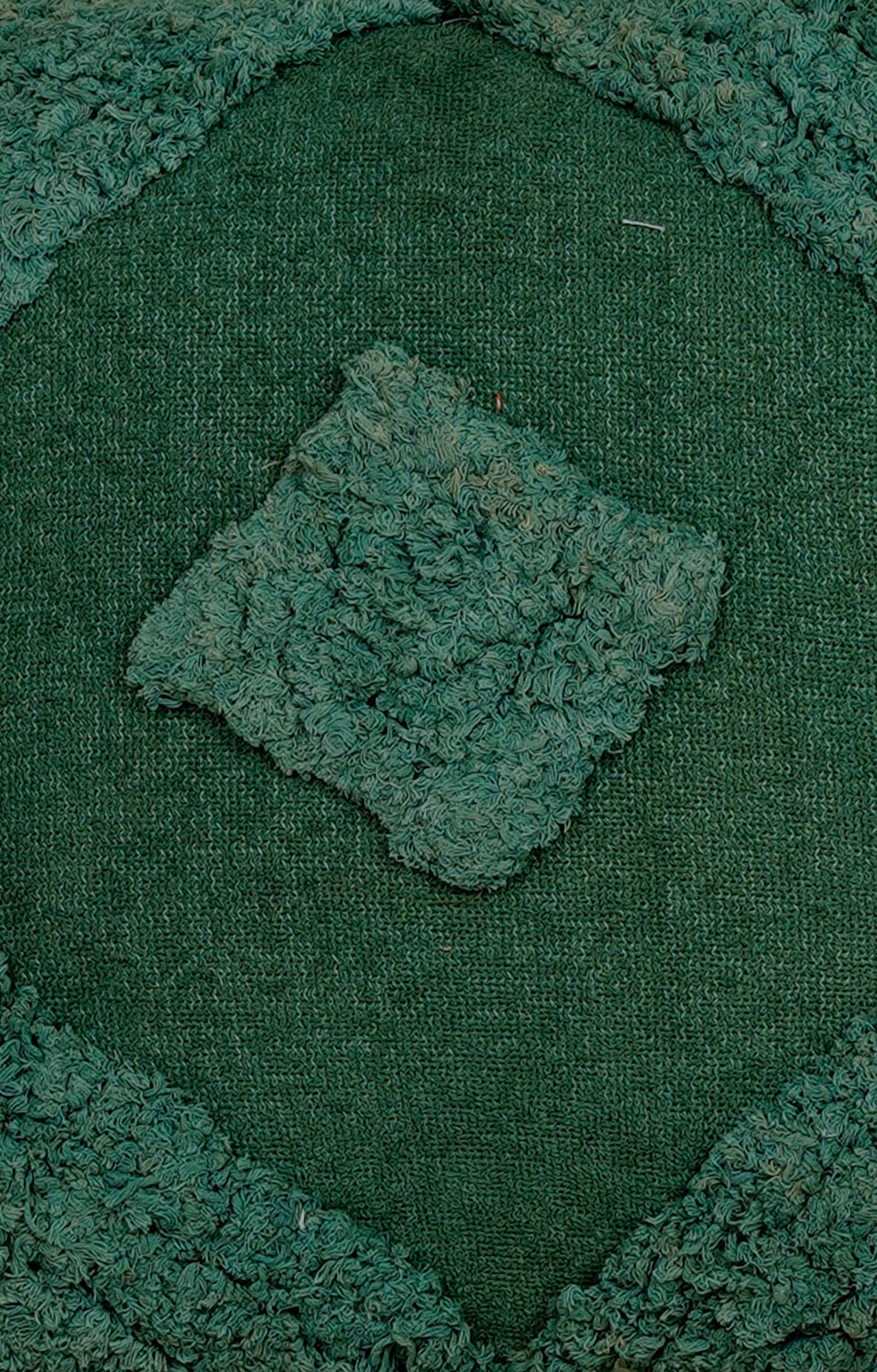 Green Tufted Cushion with Tassel Detailing