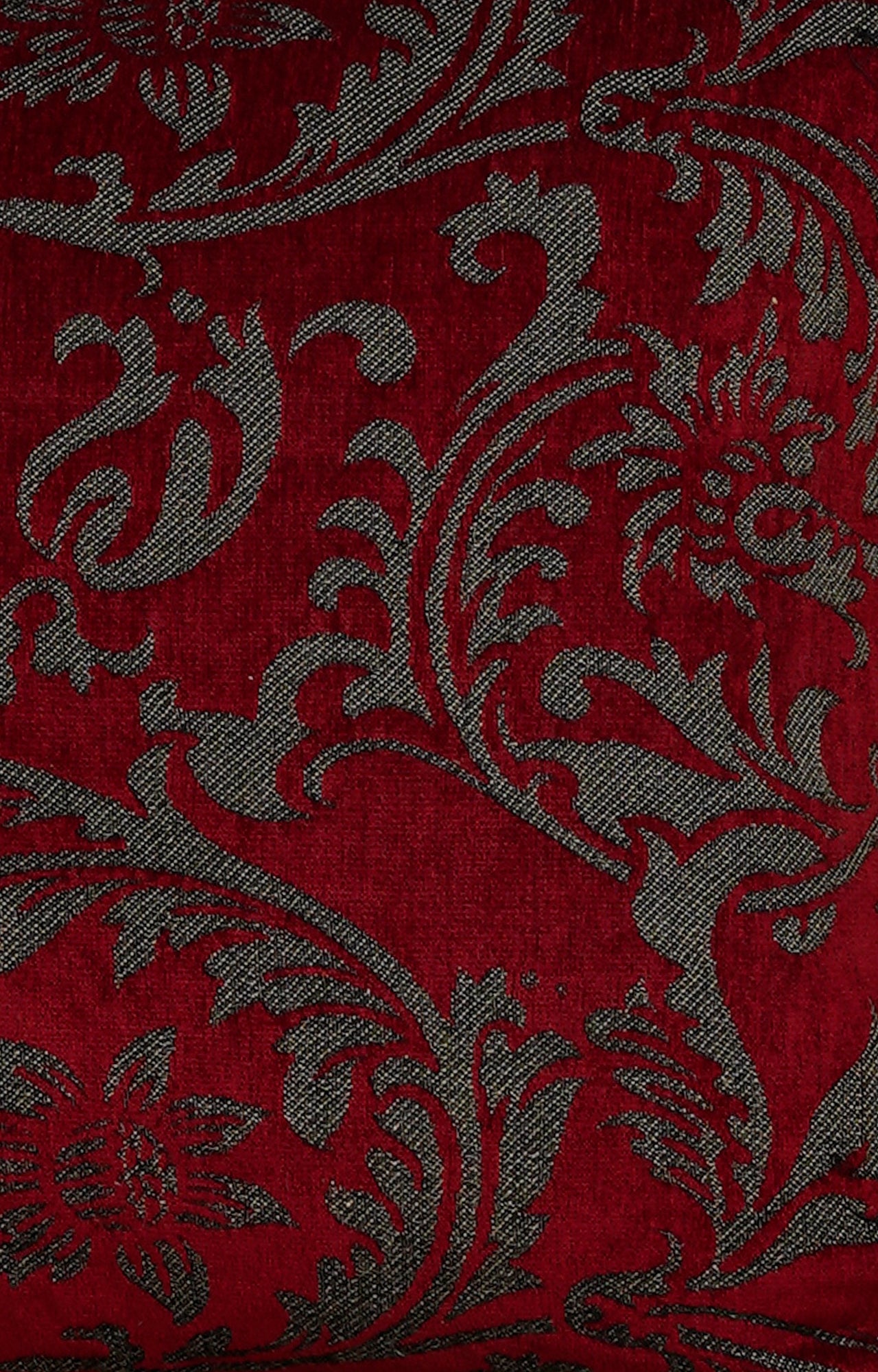 Red Cushion with Intricate Floral Pattern