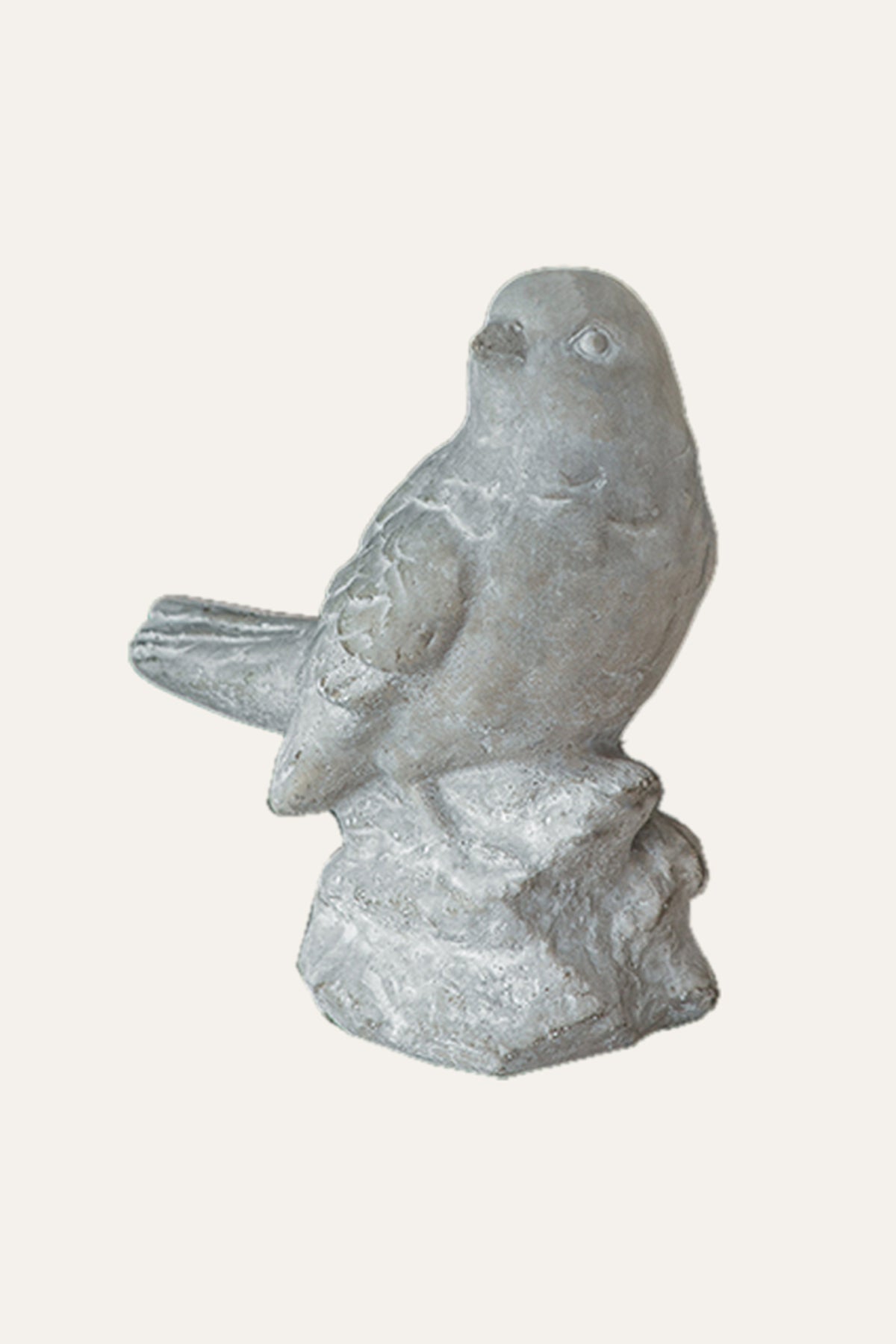 perched bird figurine on rock base