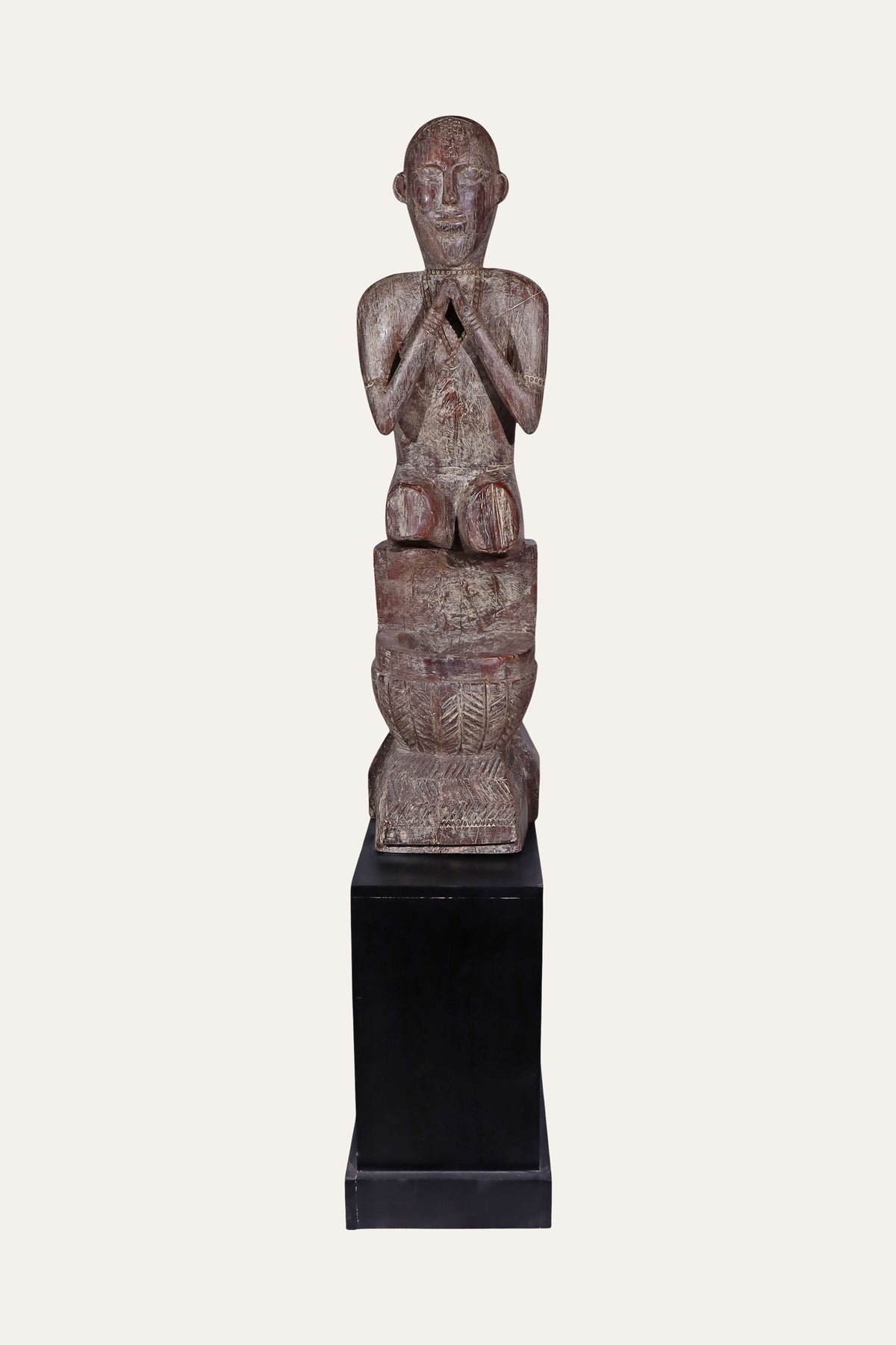 praying wooden folk figurine