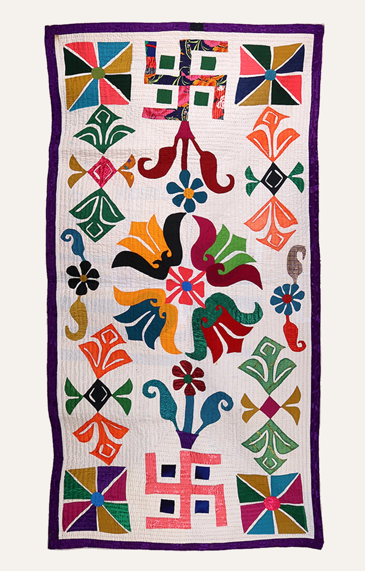 Vibrant Swastika And Floral Applique Wall Hanging