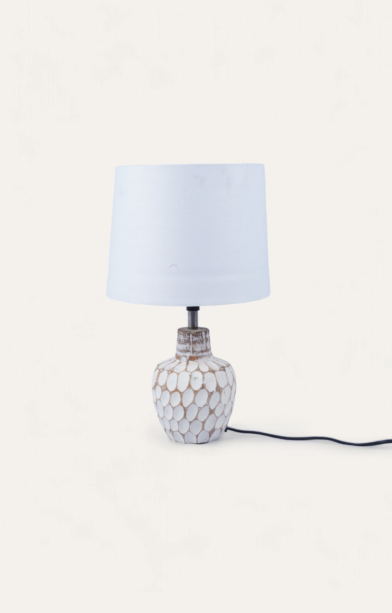 Thumb pressed table lamp