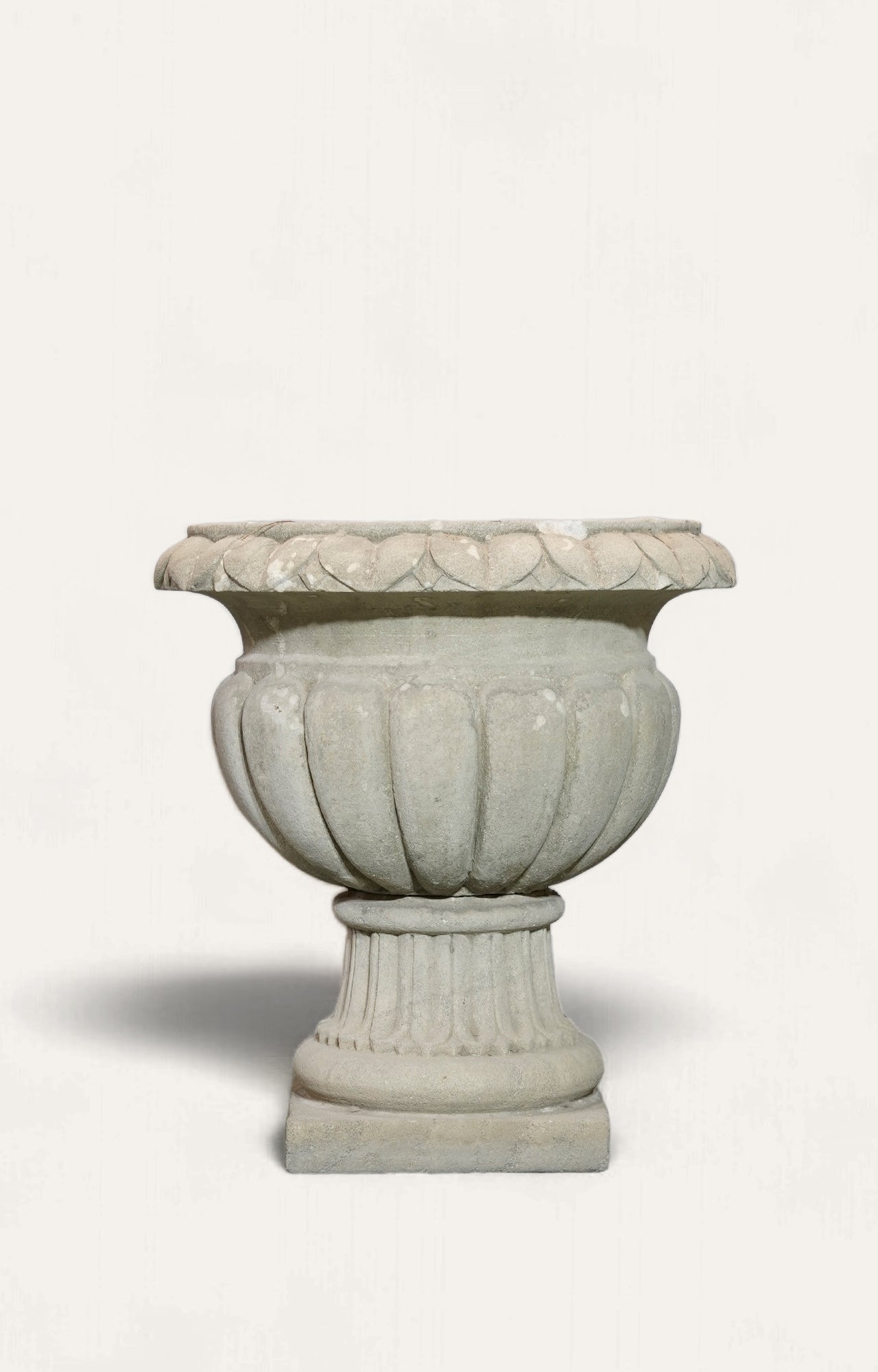 A Large-scaled French Neoclassical Carved Limestone Gadrooned Urns