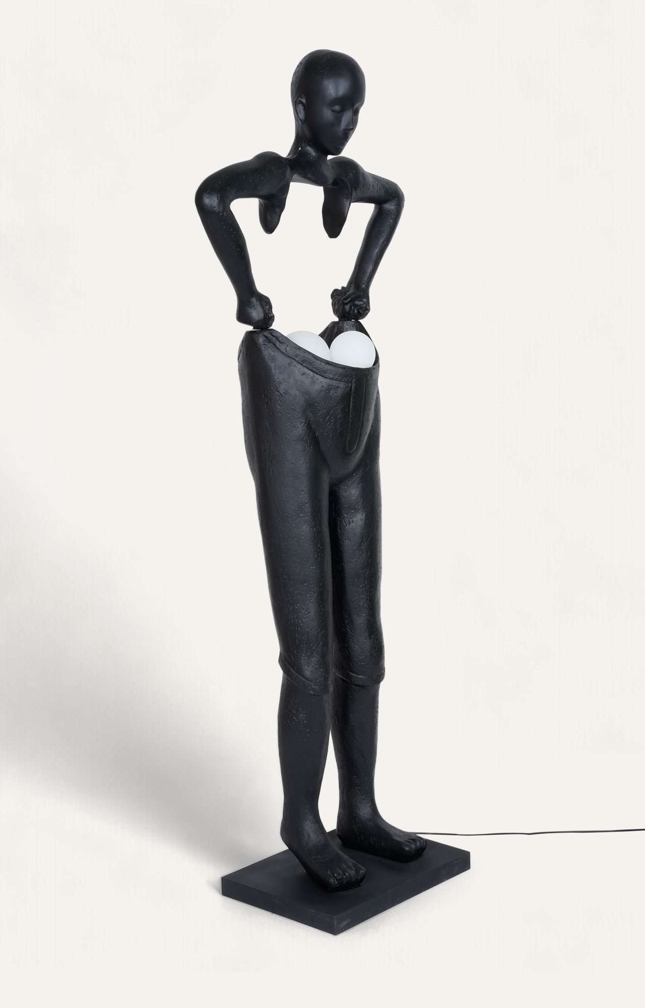 A body Sculpture Holding Floor Lamp