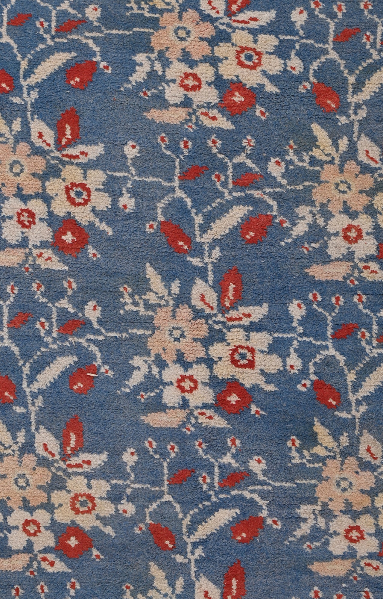 5 x 8 Ft Beautiful Blue base handknotted Agra Carpet with flowers all over.