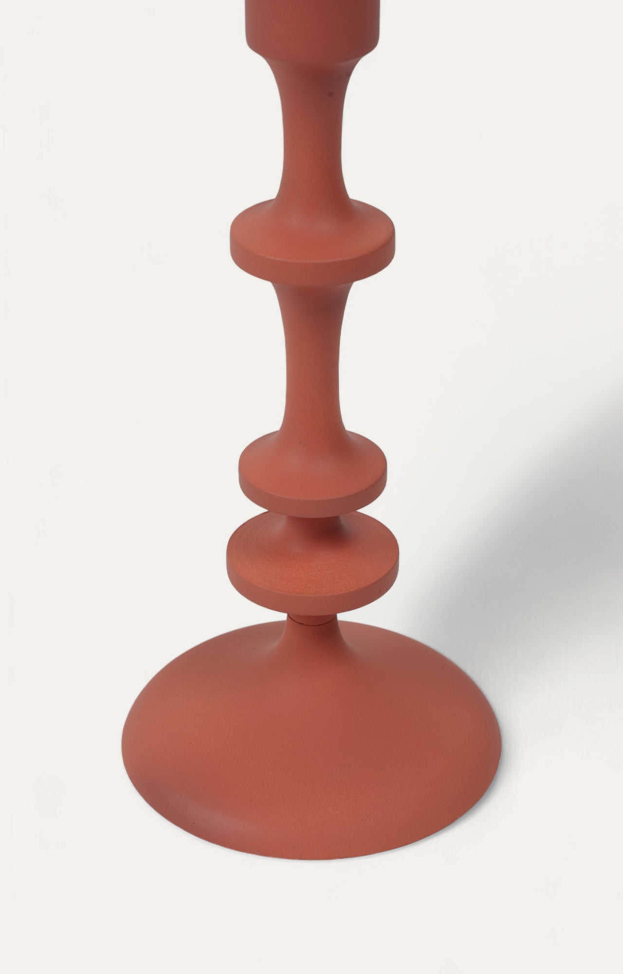 Timeless Elegance: The Enchanting Allure of a Vintage Reddish Metal Candle Stand