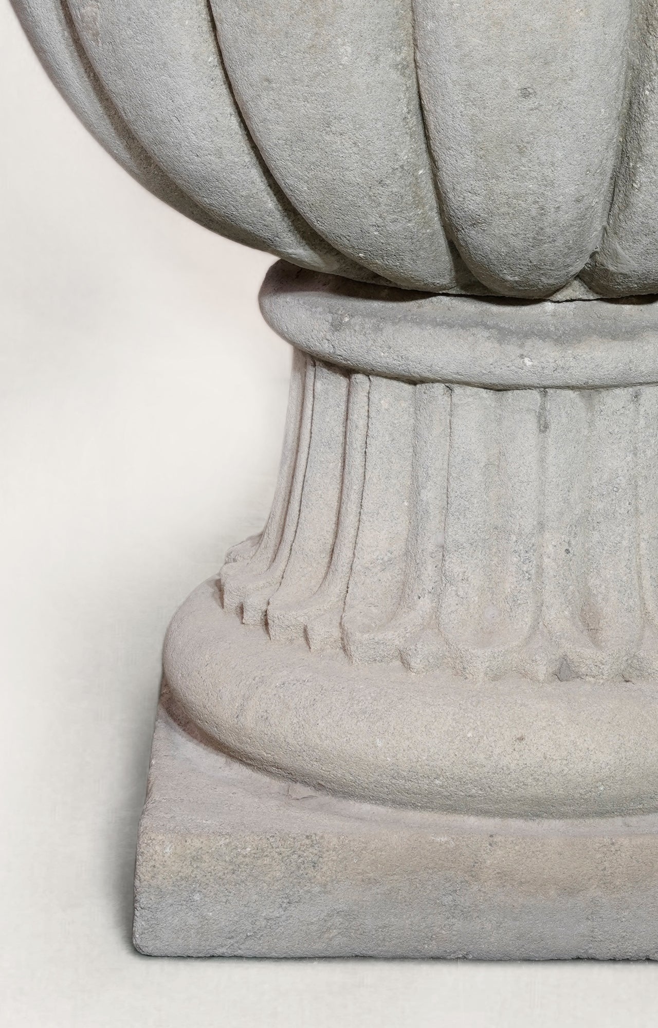 A Large-scaled French Neoclassical Carved Limestone Gadrooned Urns