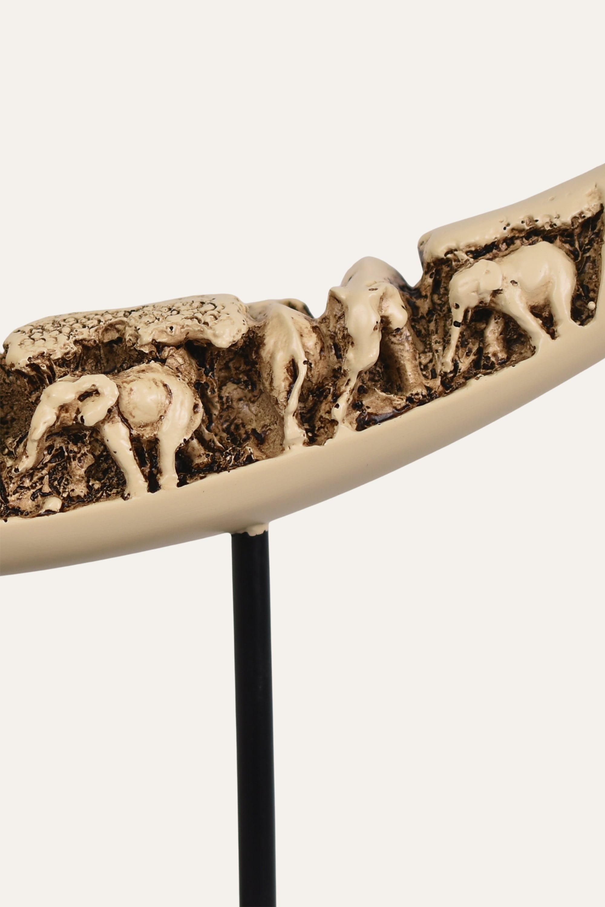 Decorative piece with elephant carvings
