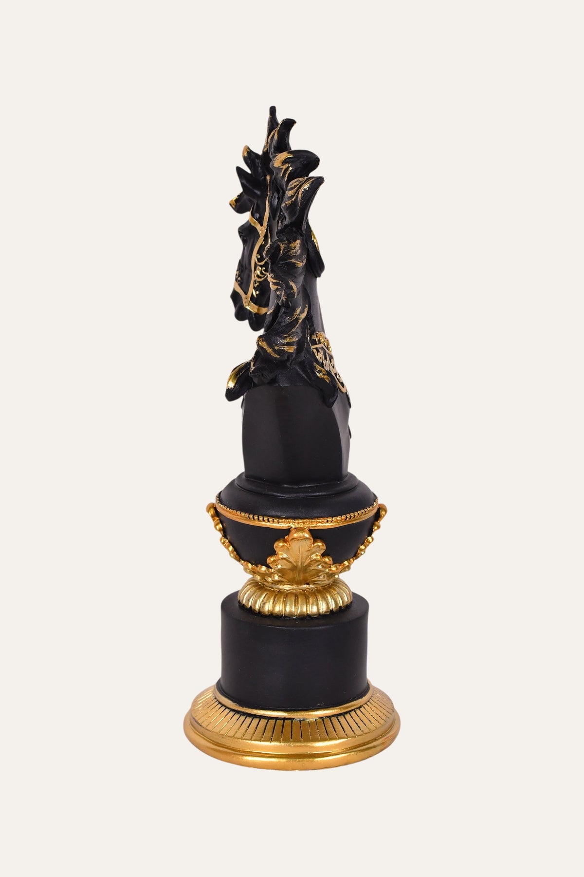 Black horse head sculpture with gold accents