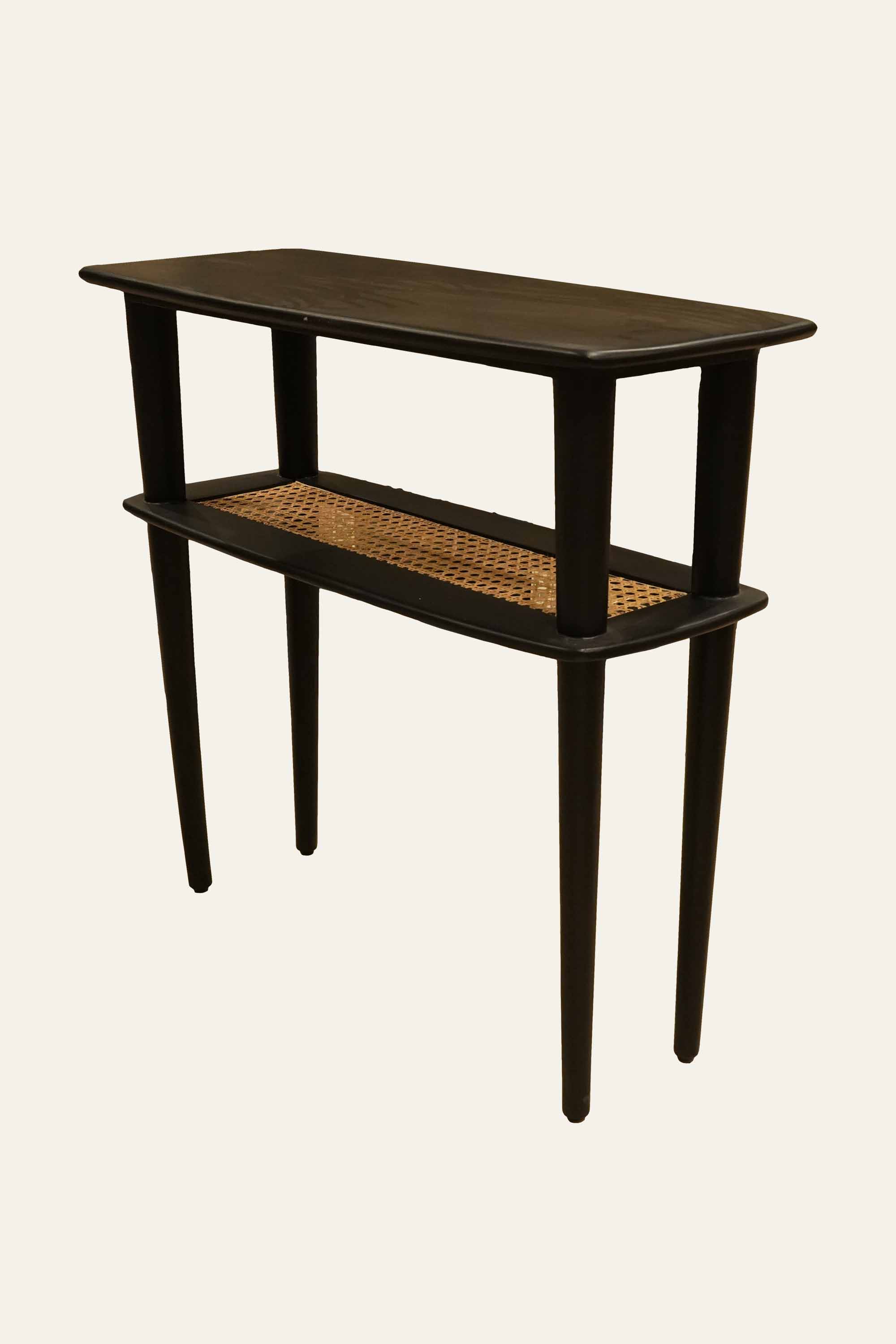 Black wooden console table with cane shelf